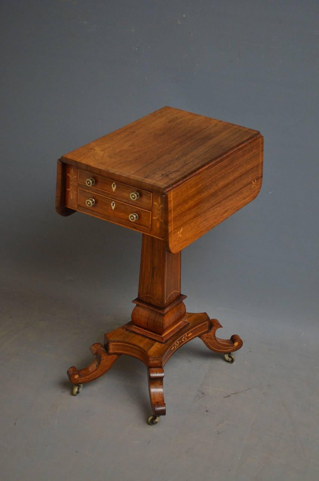 Sn4289 fine Regency drop leaf table in rosewood, having string inlaid top above two string inlaid drawers and two dummy drawers to back, all fitted with brass handles and flanked by further satinwood inlays, raised on square column terminating in