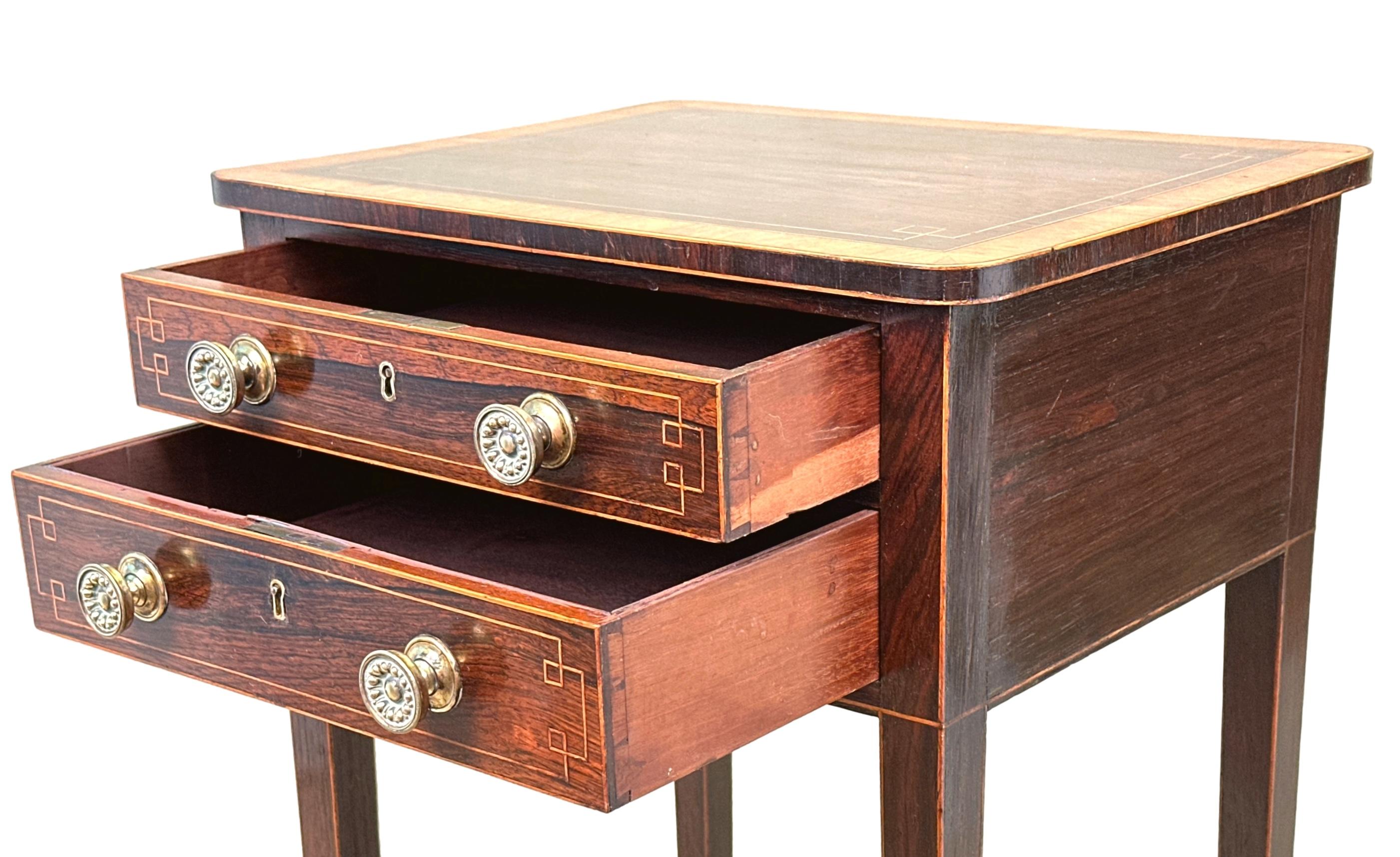 An Exceptionally Good Quality Regency Period Rosewood Recatngular Occasional Lamp Table, Having Superbly Figured Top With Satinwood Crossbanded Decoration, Over Two Mahogany Lined Drawers With Boxwood Strung Decoration And Replacement Brass Handles,