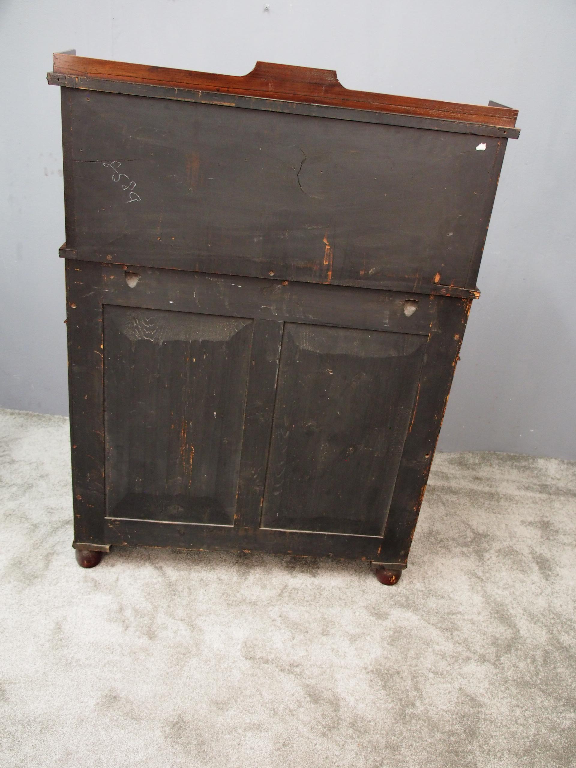 Regency rosewood and ormolu-mounted secretaire chiffonier, circa 1815. With raised back, three quarter gallery and a brass motif at the centre of the raised section, with brass inlay. Brass beaded fore-edge. Upright held in place by 2 S-scroll