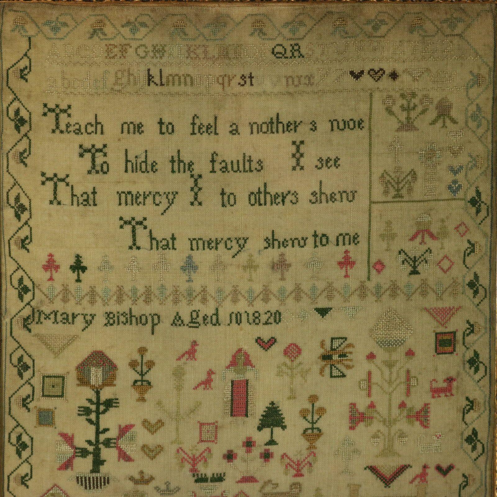 Regency Sampler, 1820, by Mary Bishop. The sampler is worked in silk on a linen ground, mainly in cross stitch. Meandering strawberry border. Colours pink, black, green, gold, blue, silver and brown. Alphabets A-Z in upper case and lower case and