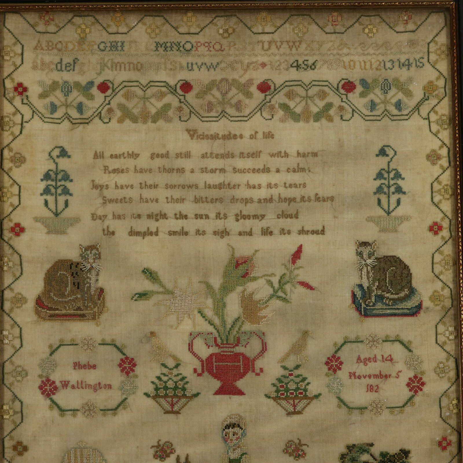 Regency Sampler, stitched in the 1820's, by Phebe Wallington. The sampler is worked in silk threads on a linen ground, mainly in cross stitch. Meandering floral border. Colours red, green, copper, gold, black and blue. Alphabets A-Z in upper case