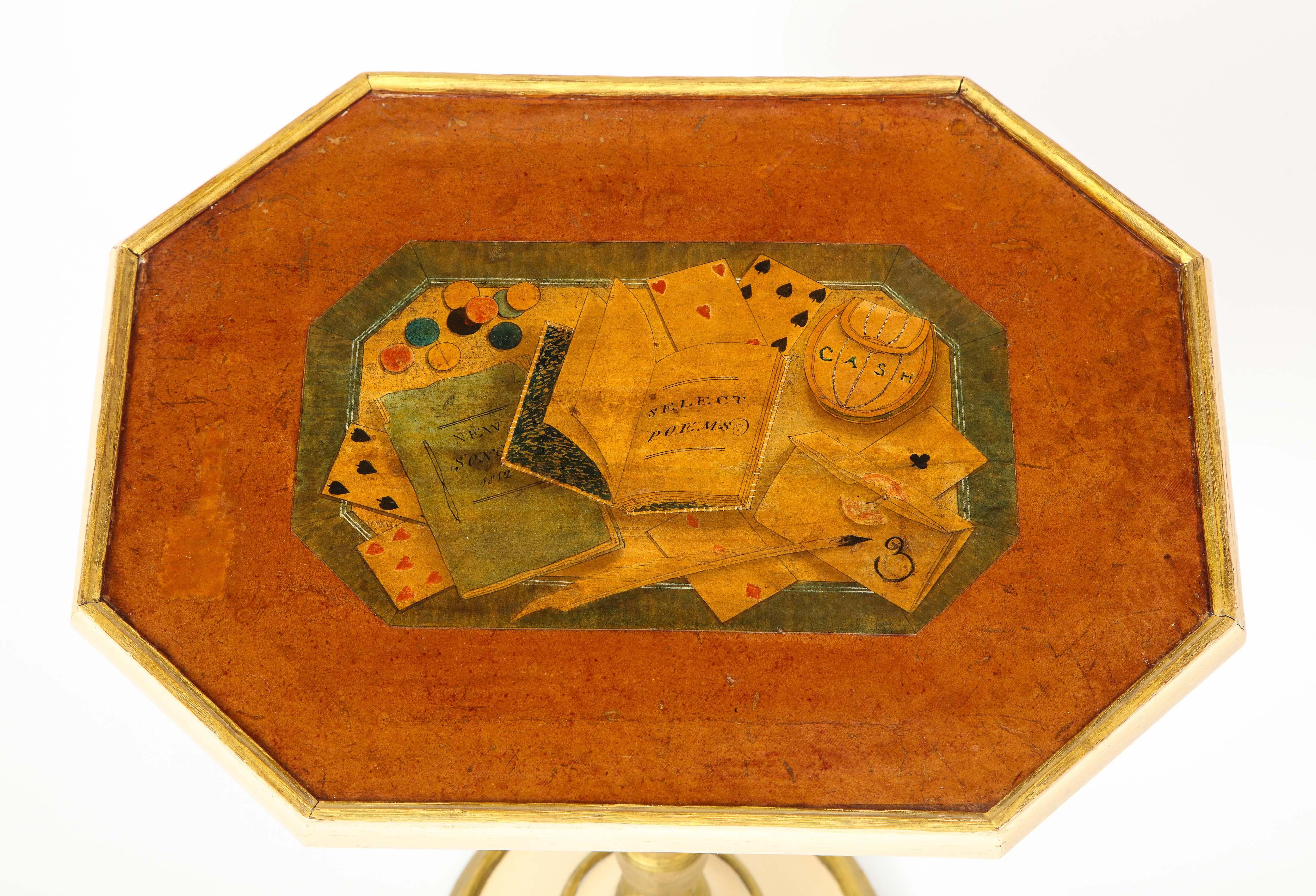 The rectangular top with canted corners whimsically inlaid with various items related to leisurely pursuits including playing cards and gambling’s, a book of poetry, a painter's palette, and a songbook dated 1812; raised on an ivory and parcel-gilt