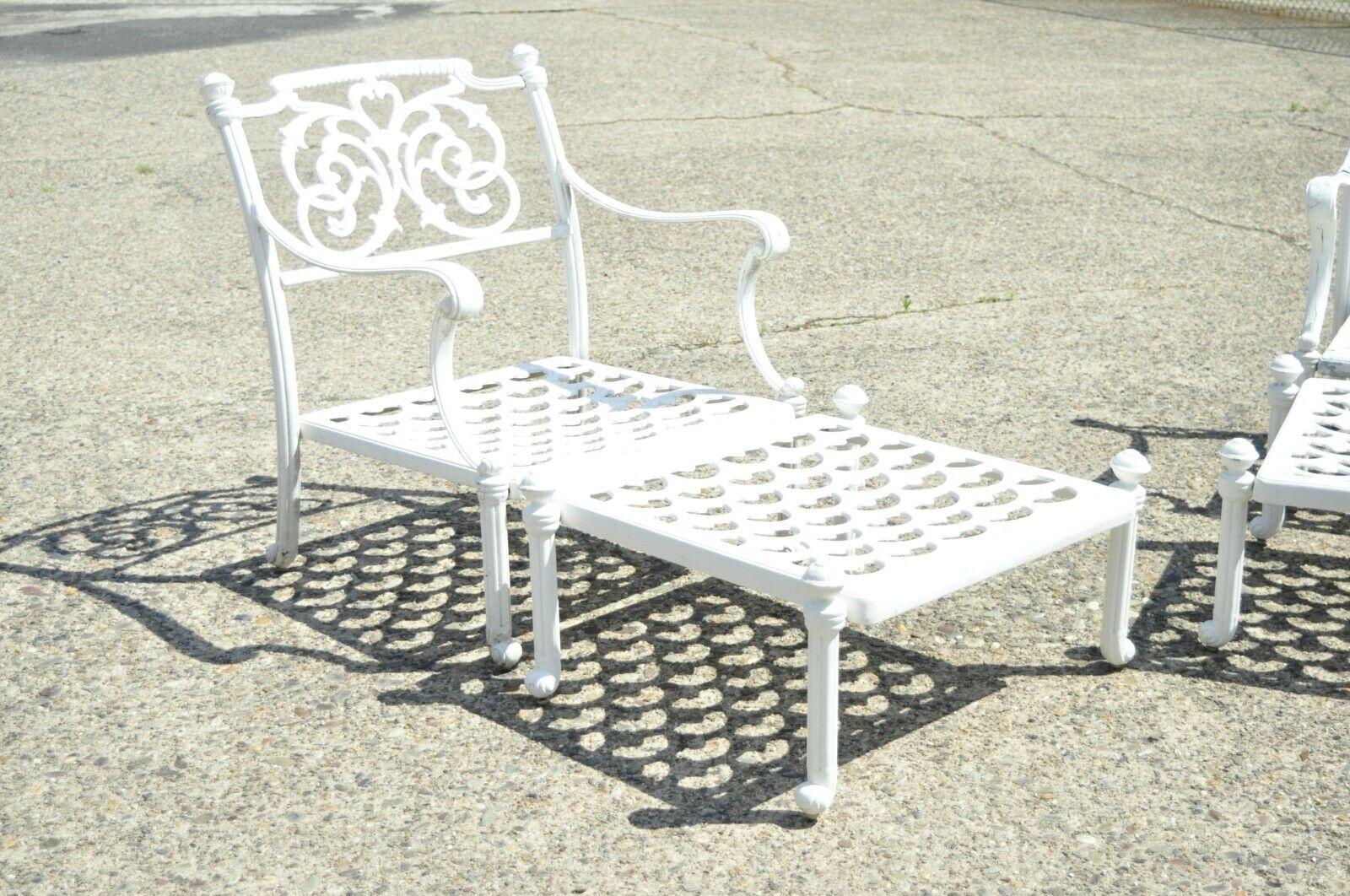 Modern Italian Regency style scrollwork cast aluminum garden patio club lounge arm chairs with ottomans- a pair. Listing includes (2) Armchairs, (2) Ottomans, fancy scroll work backs, low comfortable forms, lattice fretwork seats, cast aluminum