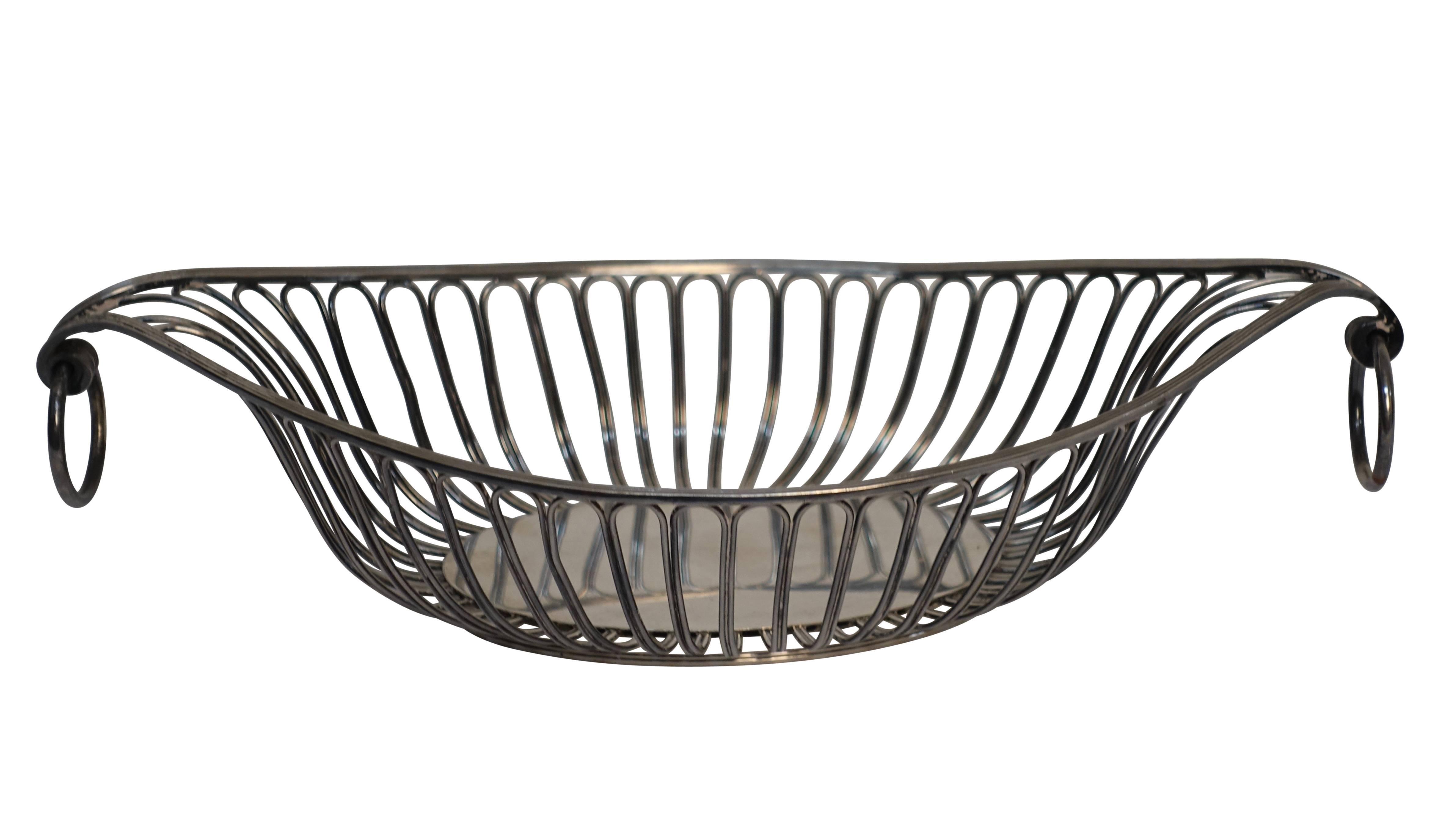 Large Sheffield silver plate Regency period gondola shape bread basket with loop ring handles, England, early 19th century.