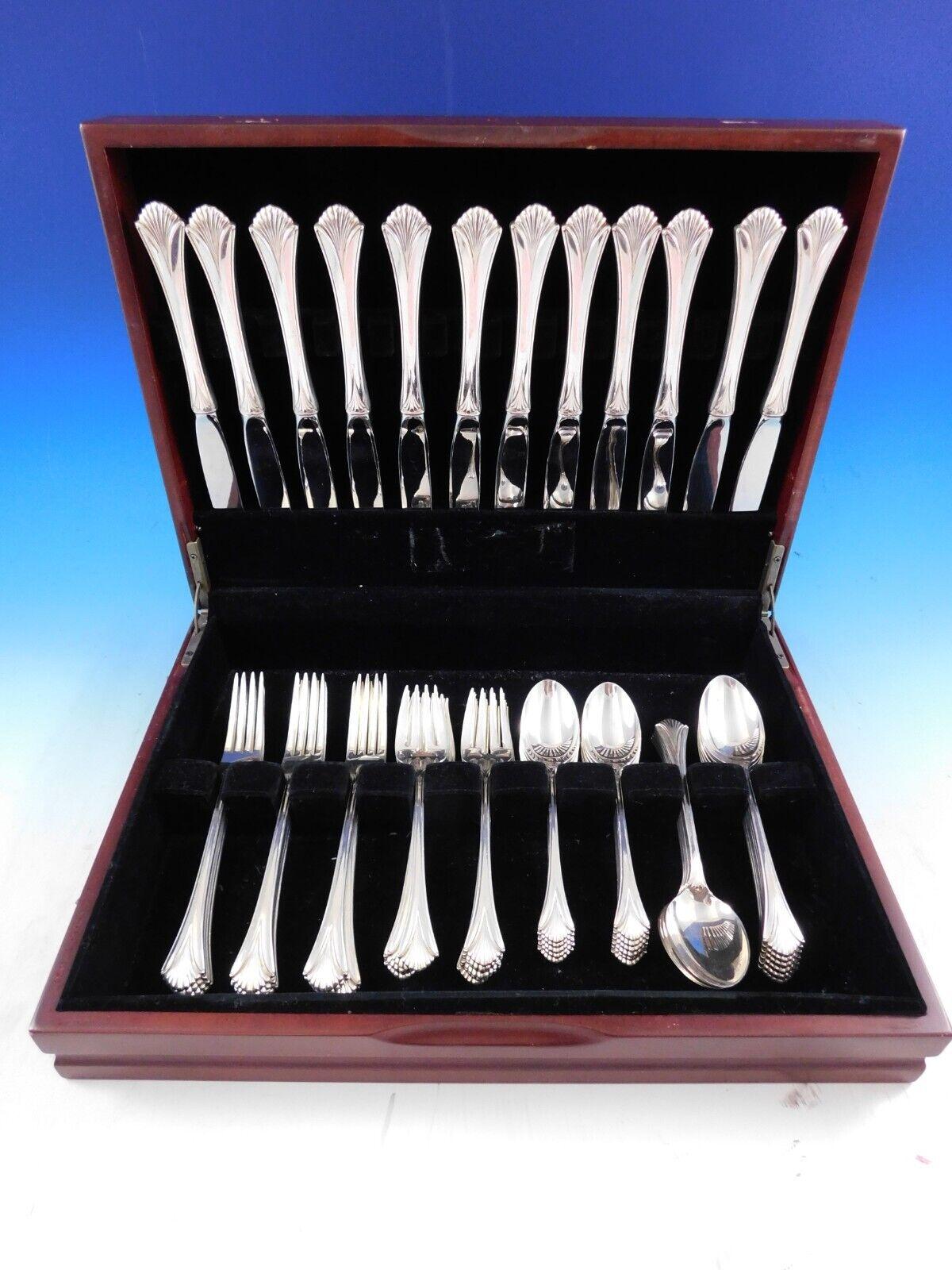 Regency shell by Lunt sterling silver flatware set, 60 pieces. This set includes:

12 knives, 9