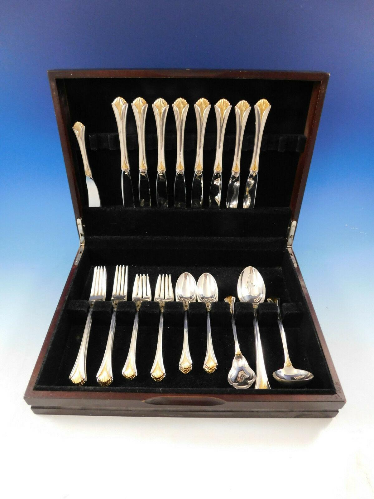 Regency Shell Gold by Lunt sterling silver Flatware set with gold accent, 37 pieces. This set includes:

8 knives, 9 1/8