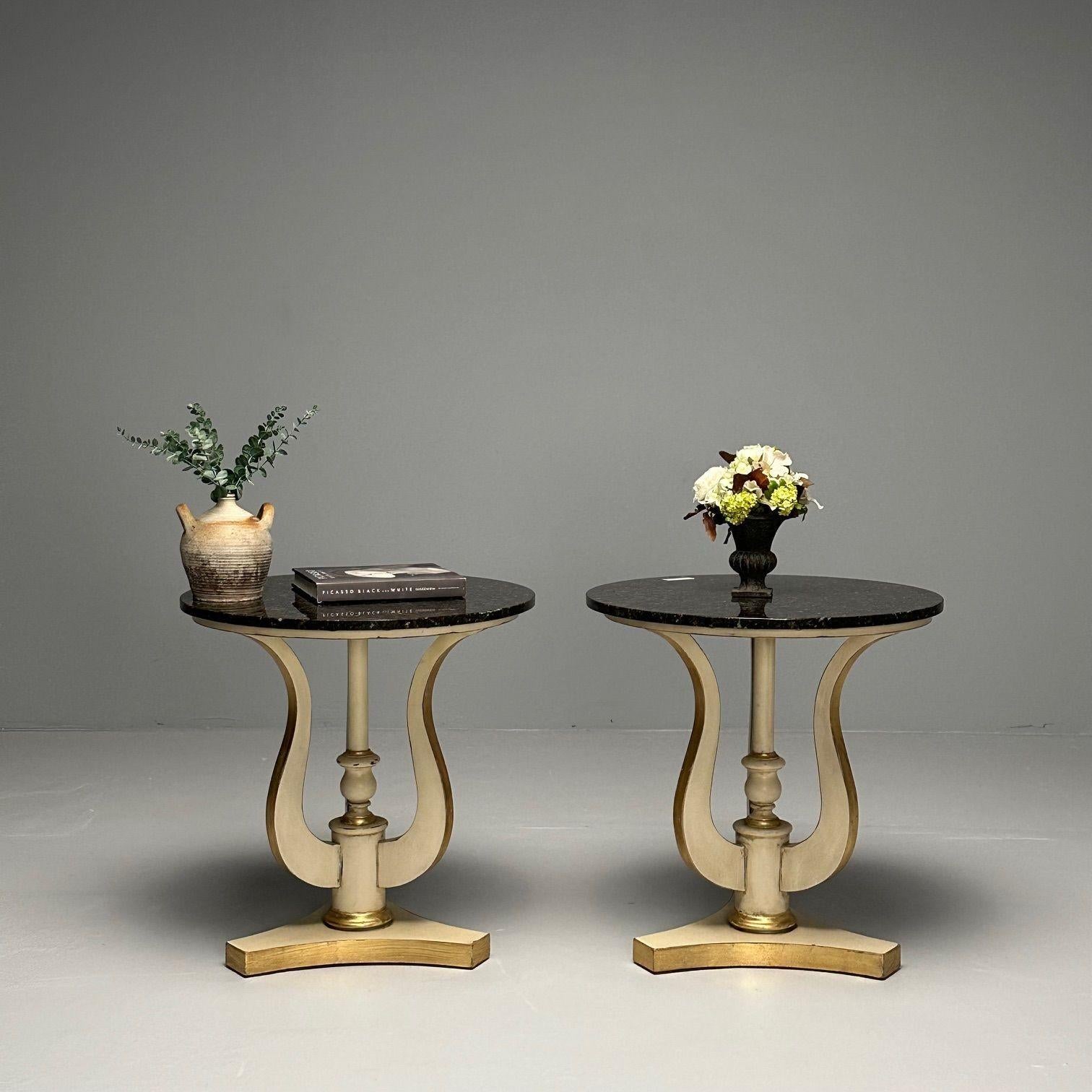 Regency, Side Tables or Pedestals, Ivory Paint, Giltwood, Marble Tops, USA, 1960s

An urn form tri pod pedestal base in parcel gilt and ivory paint decorated finish supporting a black marble top. A versatile pair of end tables, pedestal tables or