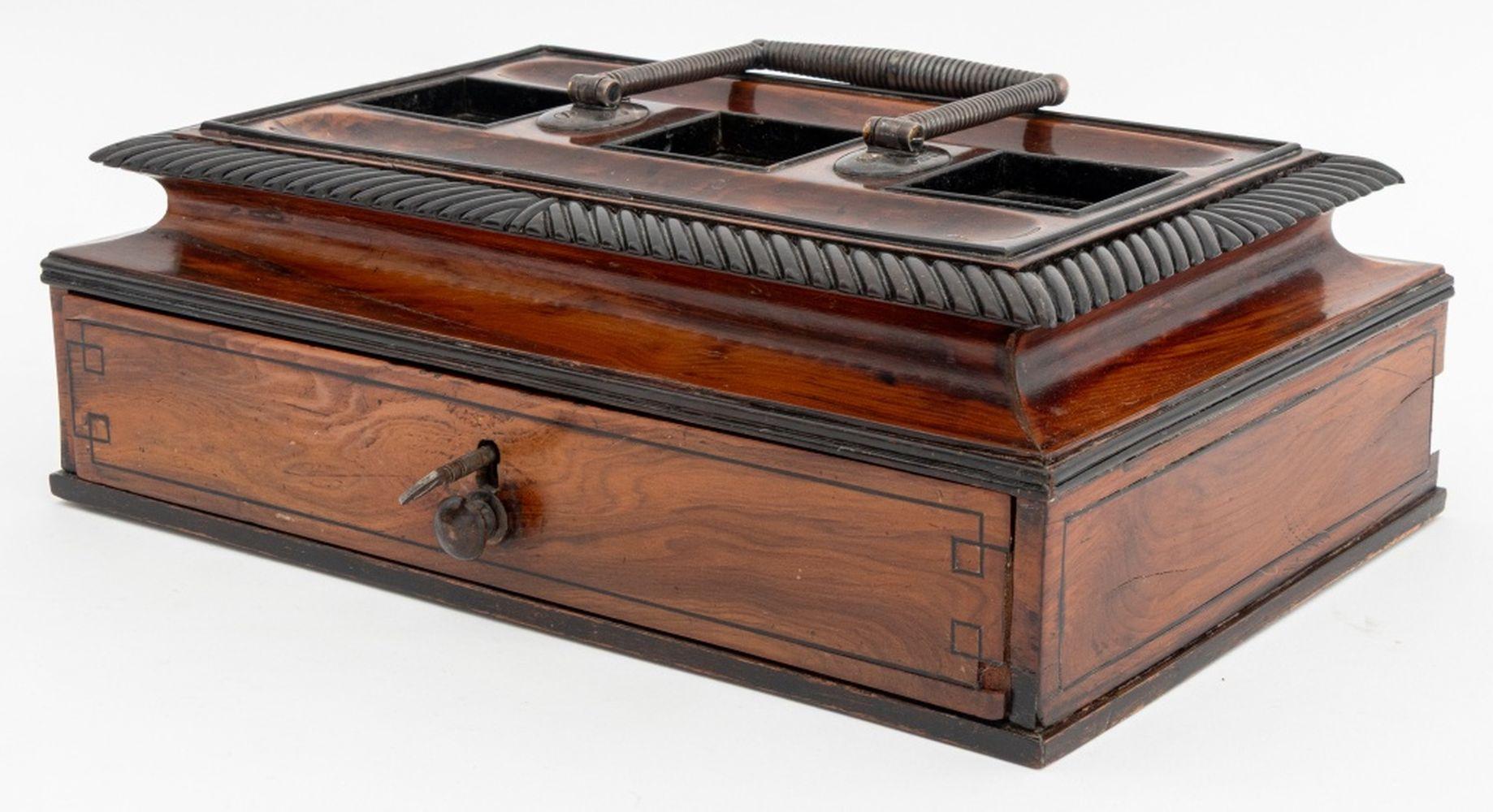 Regency Silver Mounted Yew Wood Ink Stand, struck with marks for Birmingham, 1816, and partially legible maker's hallmark, the wood stand with single drawer and key, with silver top handle and three cut crystal bottles. 6.5