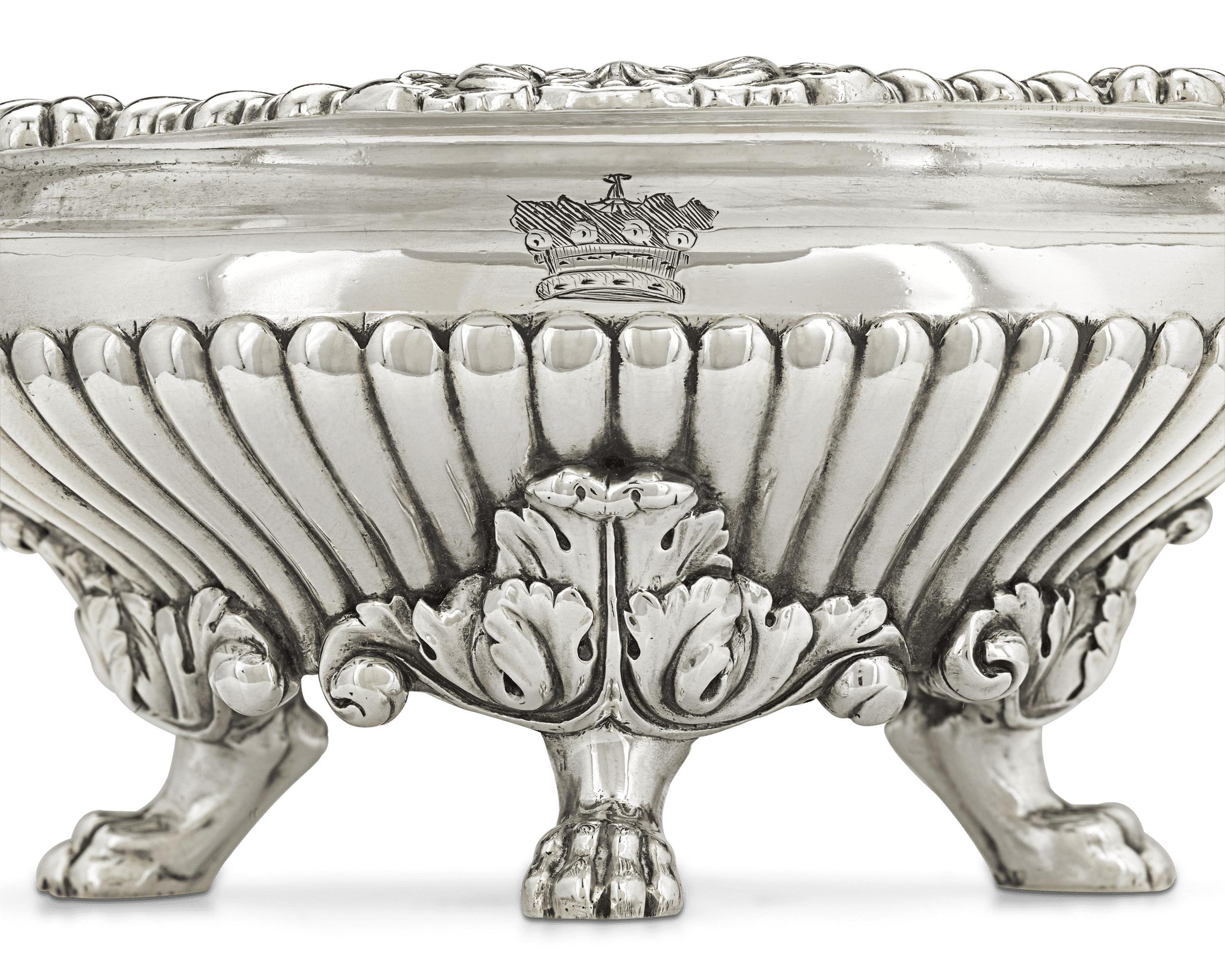 This stately pair of English Regency sterling silver salt cellars was crafted by the renowned London silversmith John Bridge, known as the co-founder of Rundell, Bridge & Rundell, who held the Royal Warrant as Crown Jewellers in the first half of