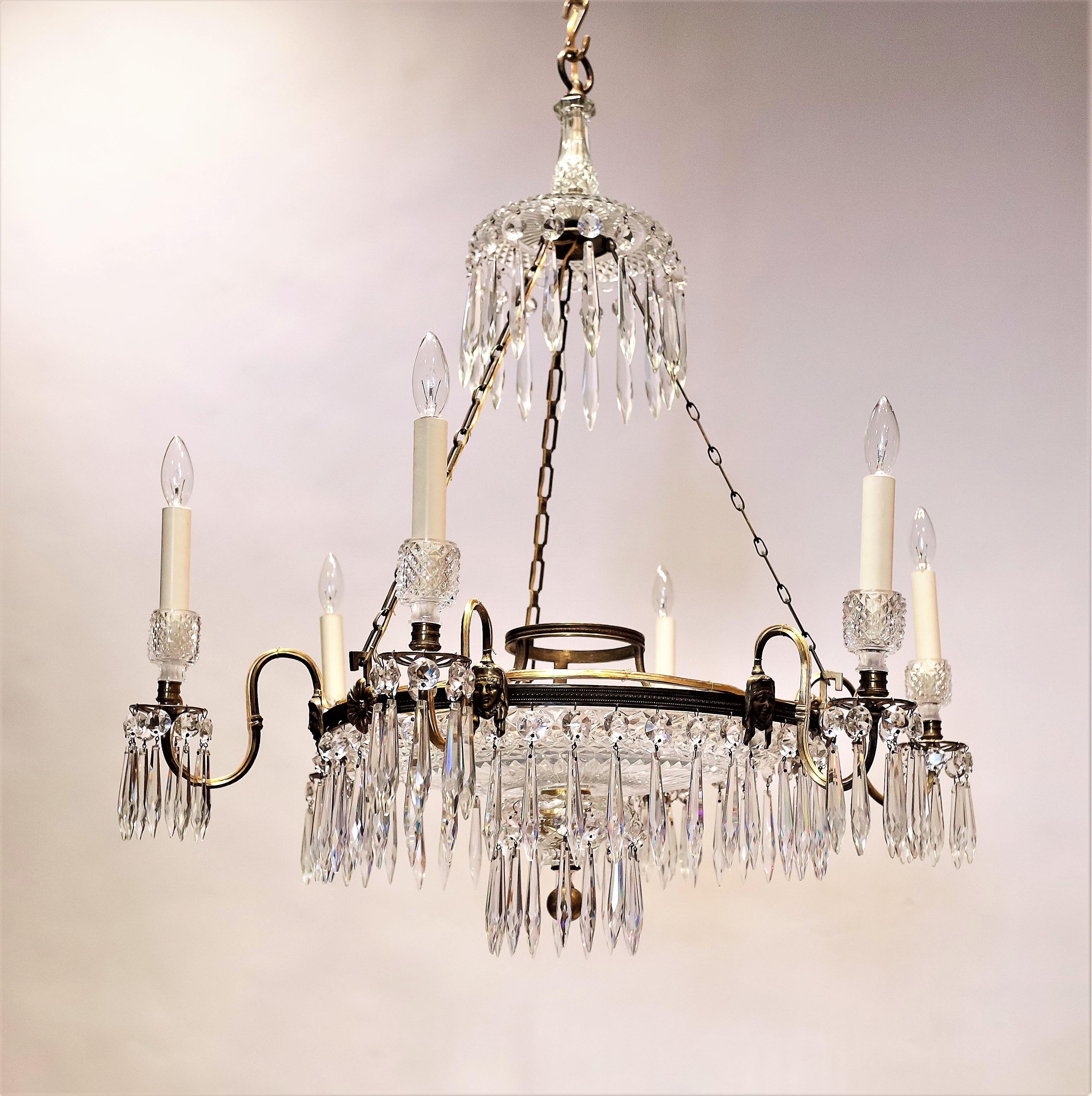 This is English Regency chandelier work at its very best - the perfect statement fixture for a grand dining room, foyer, or living room. Originally a candle-burning fixture, it has been electrified with well-concealed wiring. Hand-cast gilt and