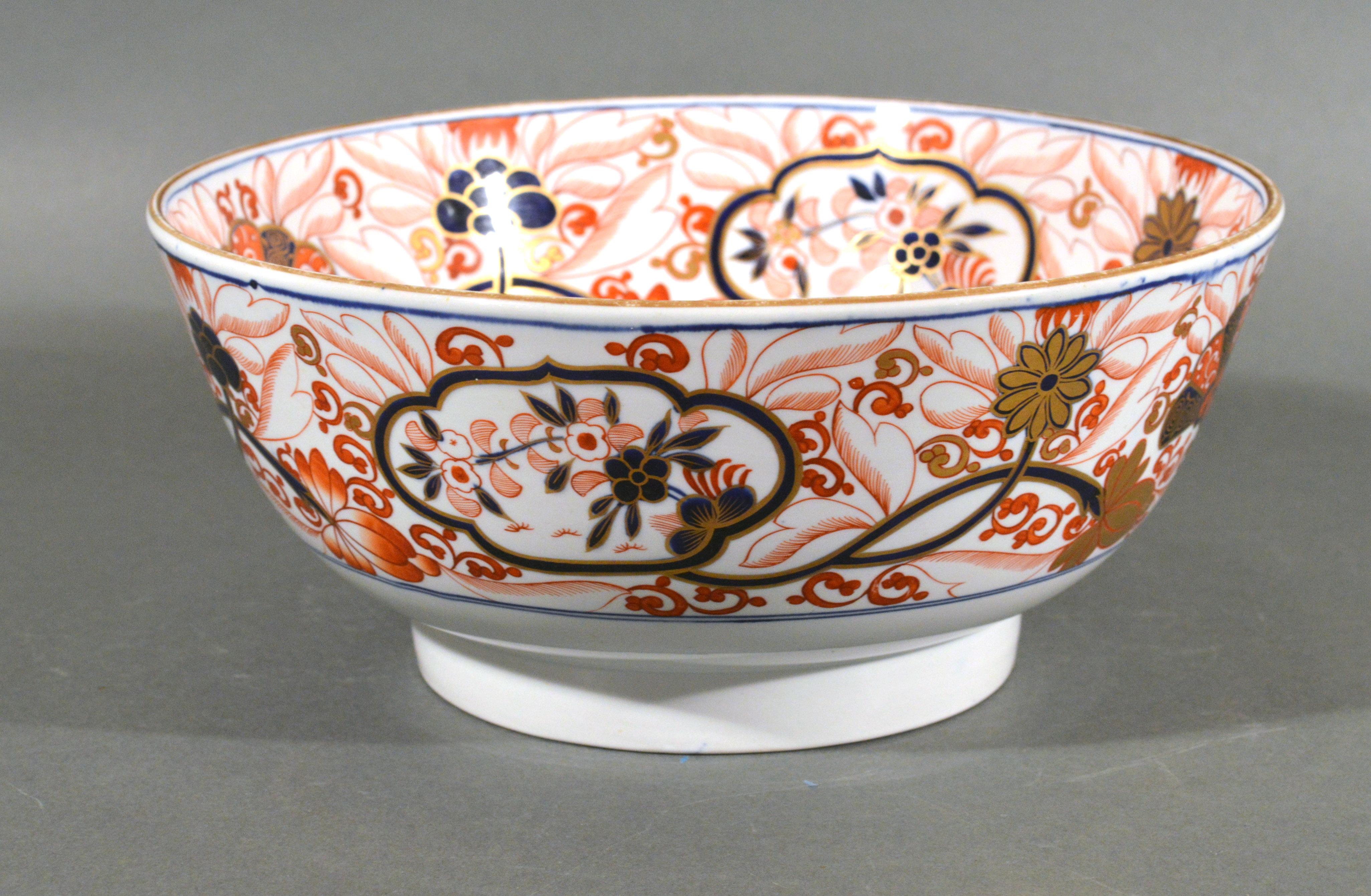 Spode Imari Bowl,
Pattern # 2283,
Spodes New Stone China,
Circa 1815-1820

The beautiful Spode new stone Imari punch bowl is painted in Imari colors with the pattern number 2283. The interior is fully painted with a jardinière issuing flowers,