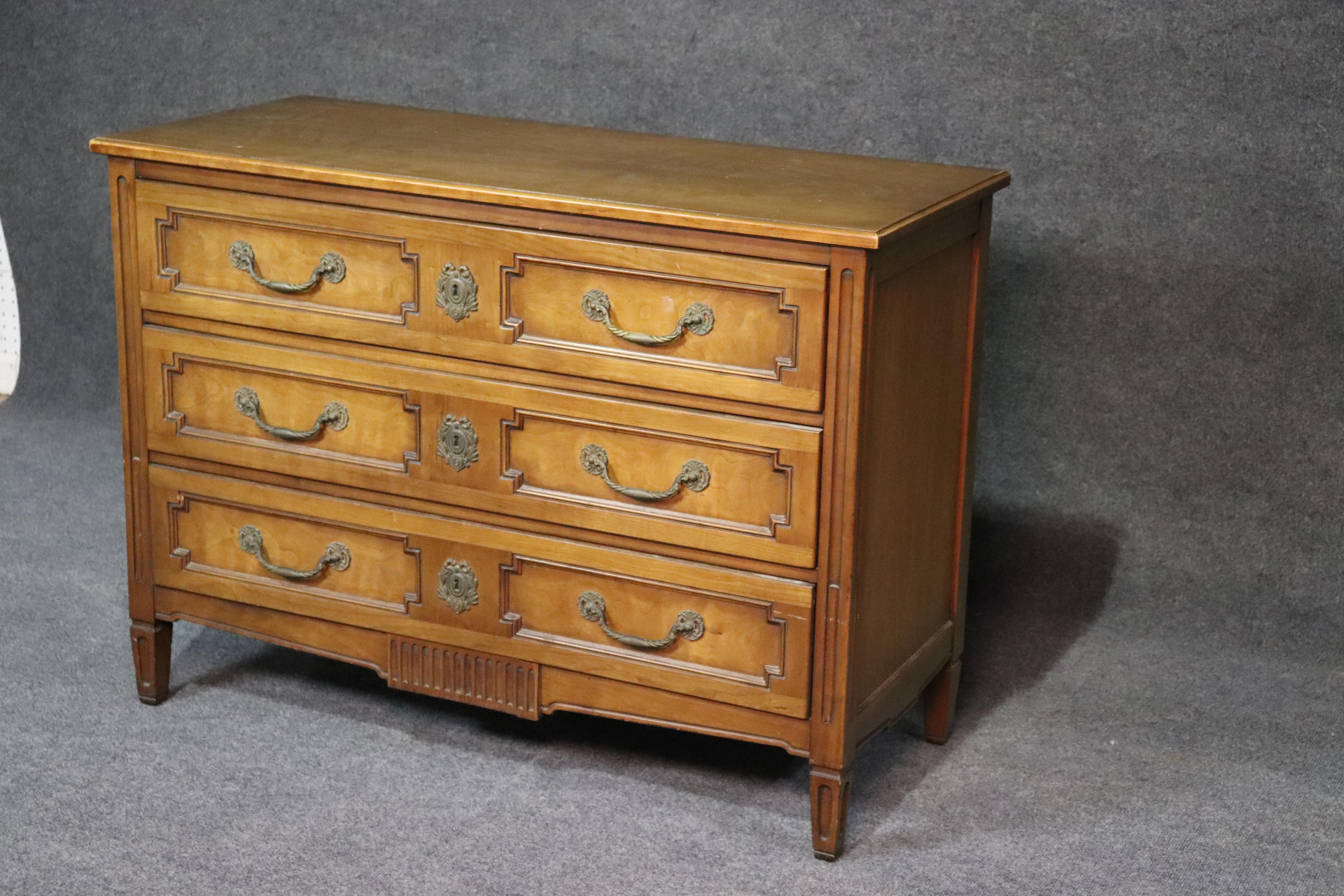 This is a simple and yet sophisticated Henredon Louis XVI style commode. Easily used as a dresser, foyer chest or commode, this piece can be placed in any room in your home and won't overwhelm it at the same time. The piece can be painted and the