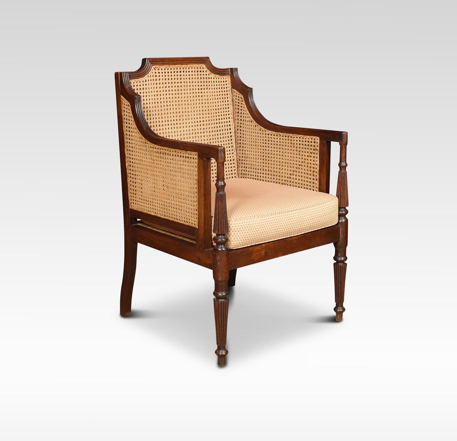 Bergère armchair, the solid oak reeded frame and inset double bergère back and arms. To the seat having removable cushion. All raised up on turned tapering legs.
Dimensions:
Height 39 inches height to seat 19 inches
Width 25 inches
Depth 24