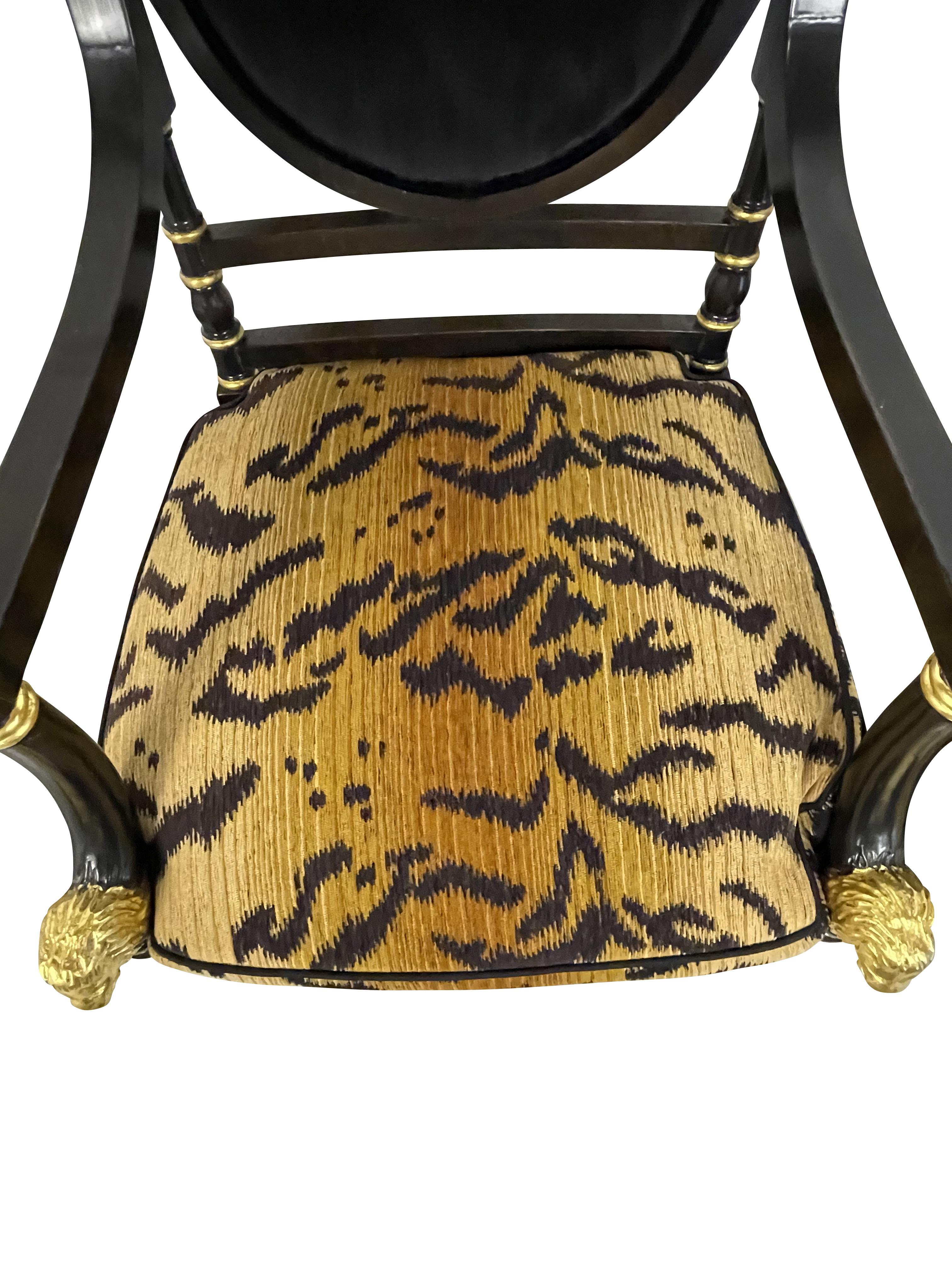 Painted Regency Style Black Ebonized and Gilt Decorated Chairs with Animal Print Cushion