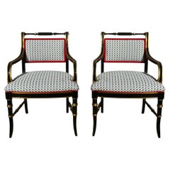 Chaises bergères en laque noire et dorées de style Régence Att. To Baker Furniture - Paire