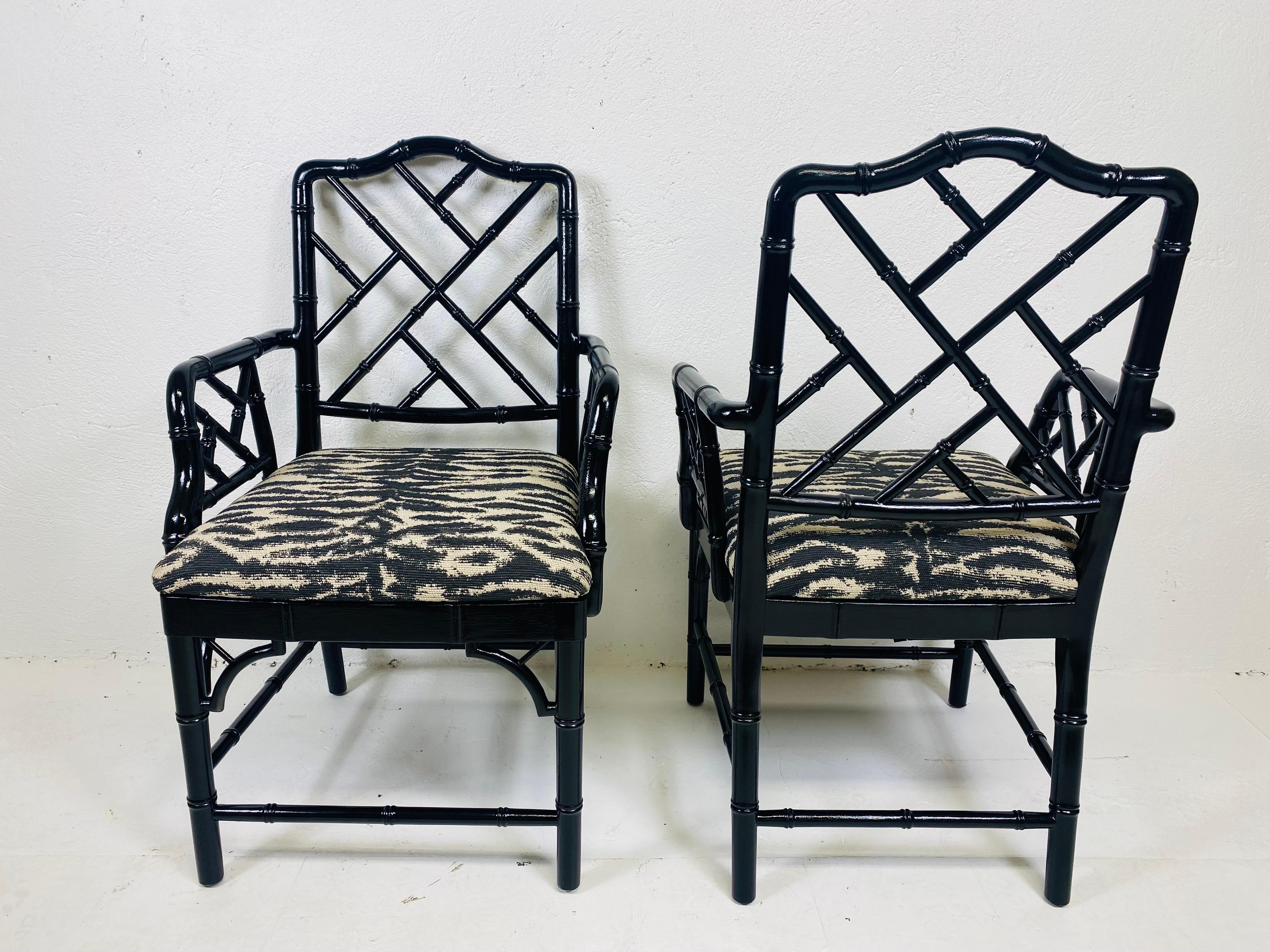 Contemporary Regency style black Lacquered faux bamboo arm chairs/pair