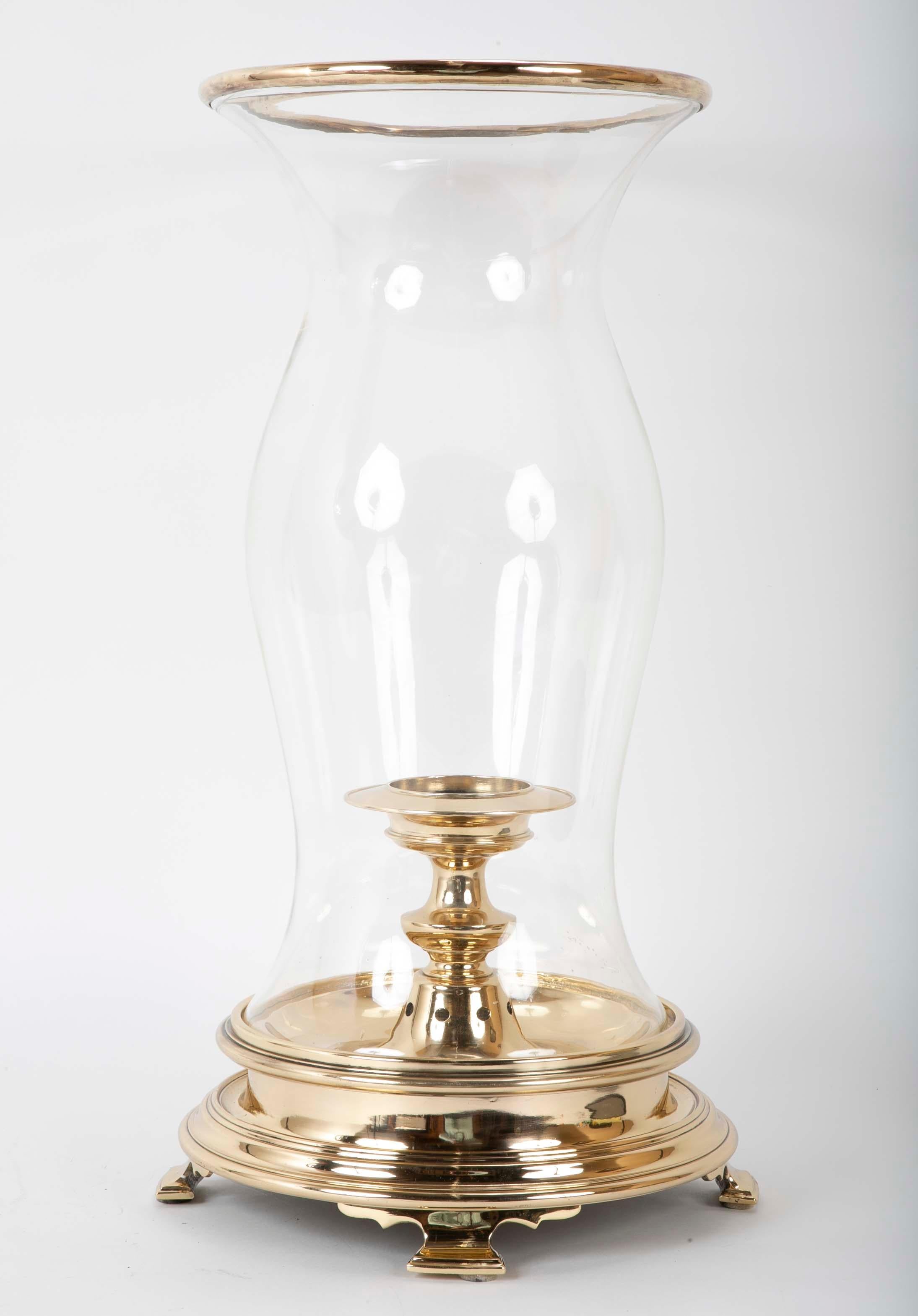 Very cool glass and brass large scale photophore, or hurricane lamp in the Regency style. The shaped glass shade with a brass rim on top over a heavy bras base, this will not blow over! Candle stand will accommodate a large candle.
Almost 2 feet