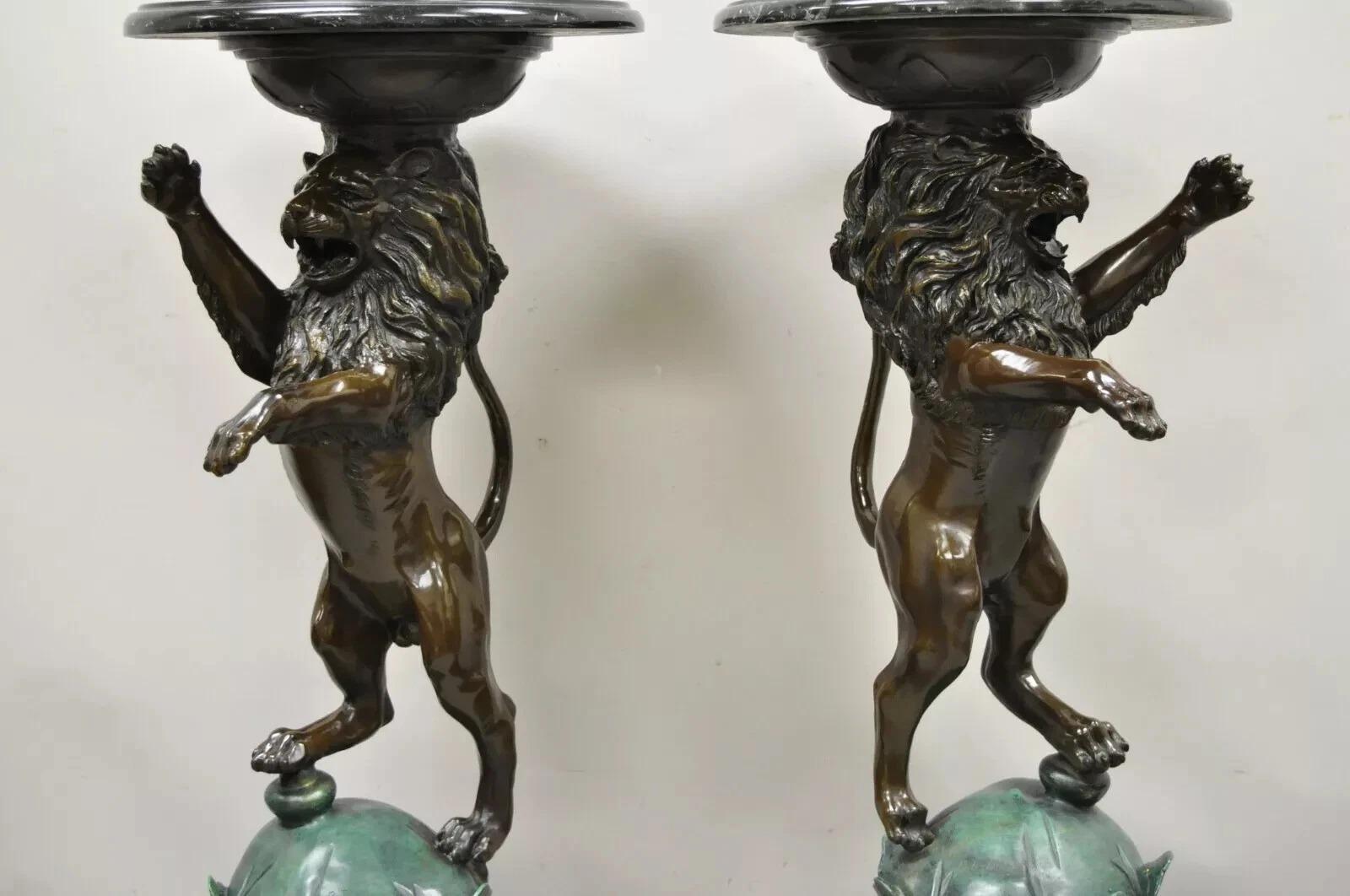 Regency Style Bronze Lion Figure Marble Top Pedestal Table after P.J Mene - a Pair. Item features right and left forms, heavy cast bronze lion figures, round black marble tops, signed 