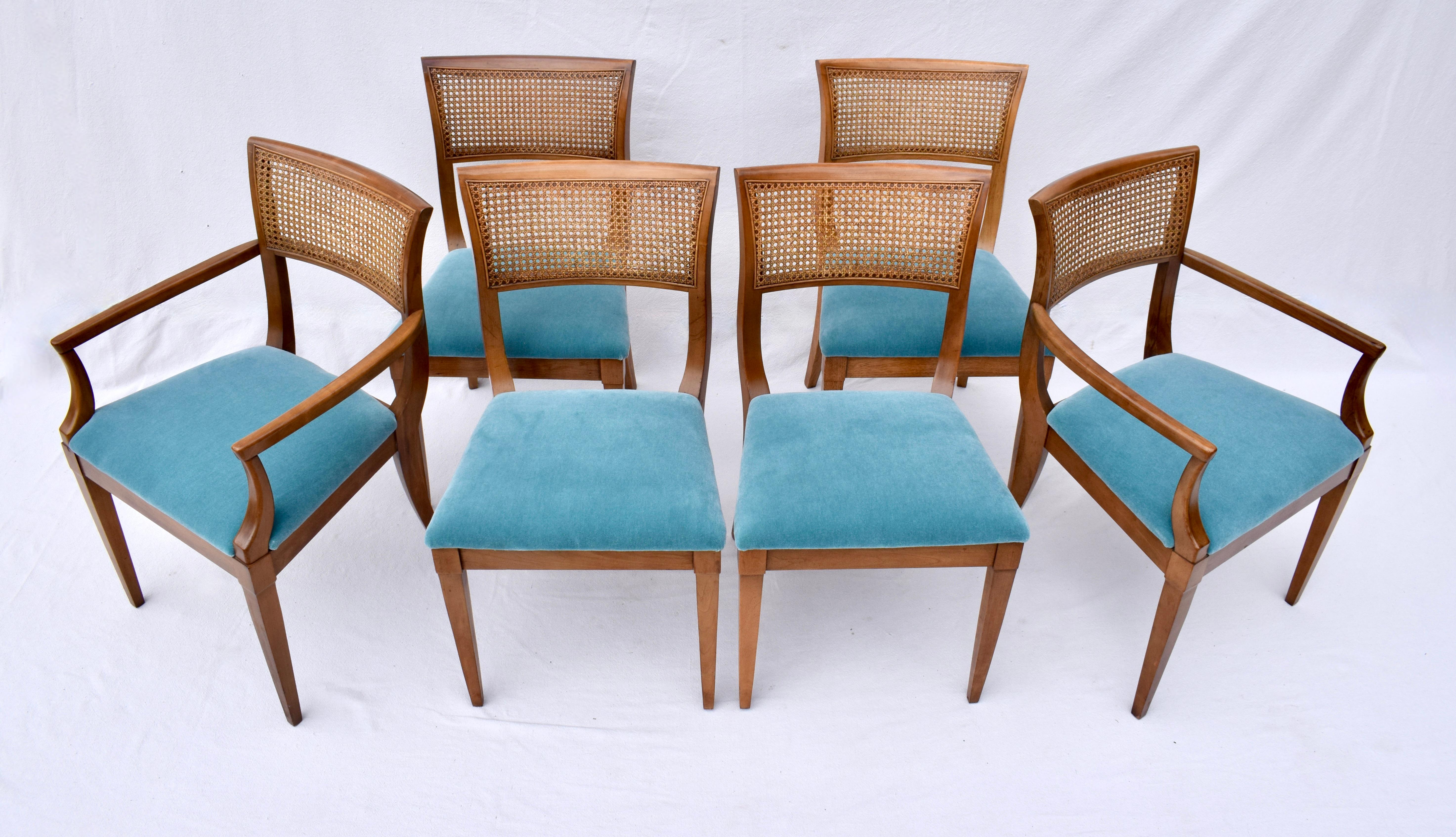 An impressive set of six cherry wood cane back dining chairs newly upholstered in plush teal Mohair consisting of four side chairs & two captains chairs. Attributed to Baker Furniture in the Regency style this transitional & timeless design is