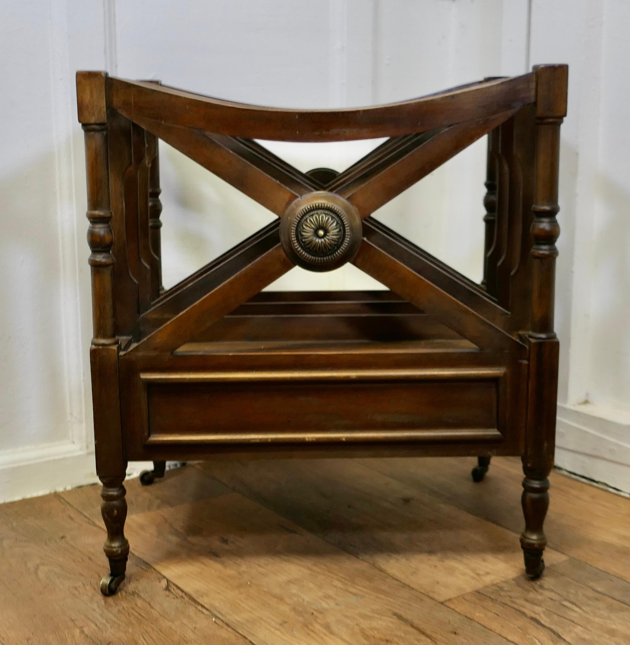 Regency Style Canterbury Magazine Stand

This is a pretty little piece, in Walnut, it stands on neat little brass casters and has a drawer at the bottom, the stand has 3 large magazine sections and a brass roundel at the centre
An excellent and good