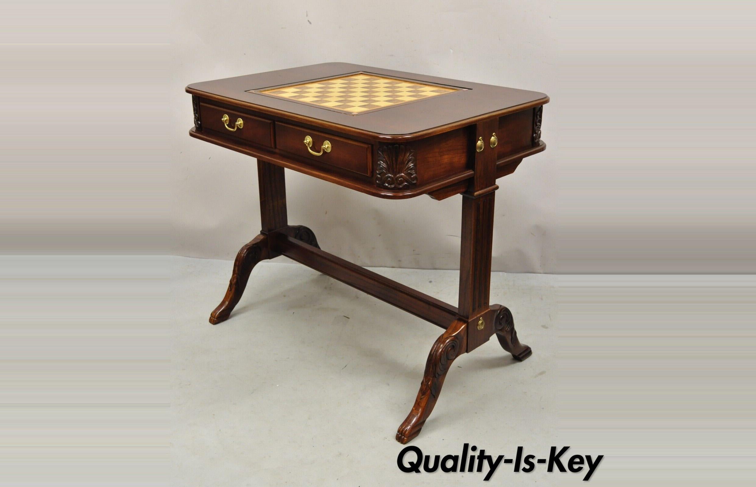 Regency Style Cherry Wood game table with flip top by Butler Specialty. Item features flip top with chess/checkerboard and backgammon, beautiful wood grain, nicely carved details, original label, 2 drawers, great style and form. Circa Late 20th