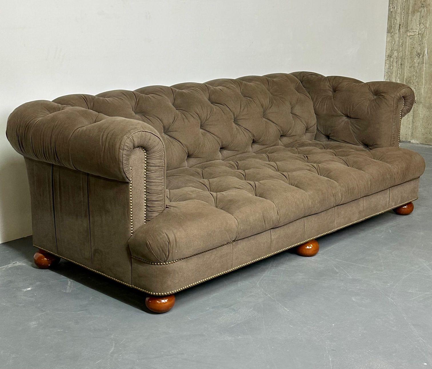 Modern Regency Style Chesterfield Tufted Sofa, Bun Legs, Pleated Fabric, Walnut
 
A fine custom quality sofa. The large mahogany bun feet supporting a tight button tufted seating area leading to a tight button tufted backrest the whole having