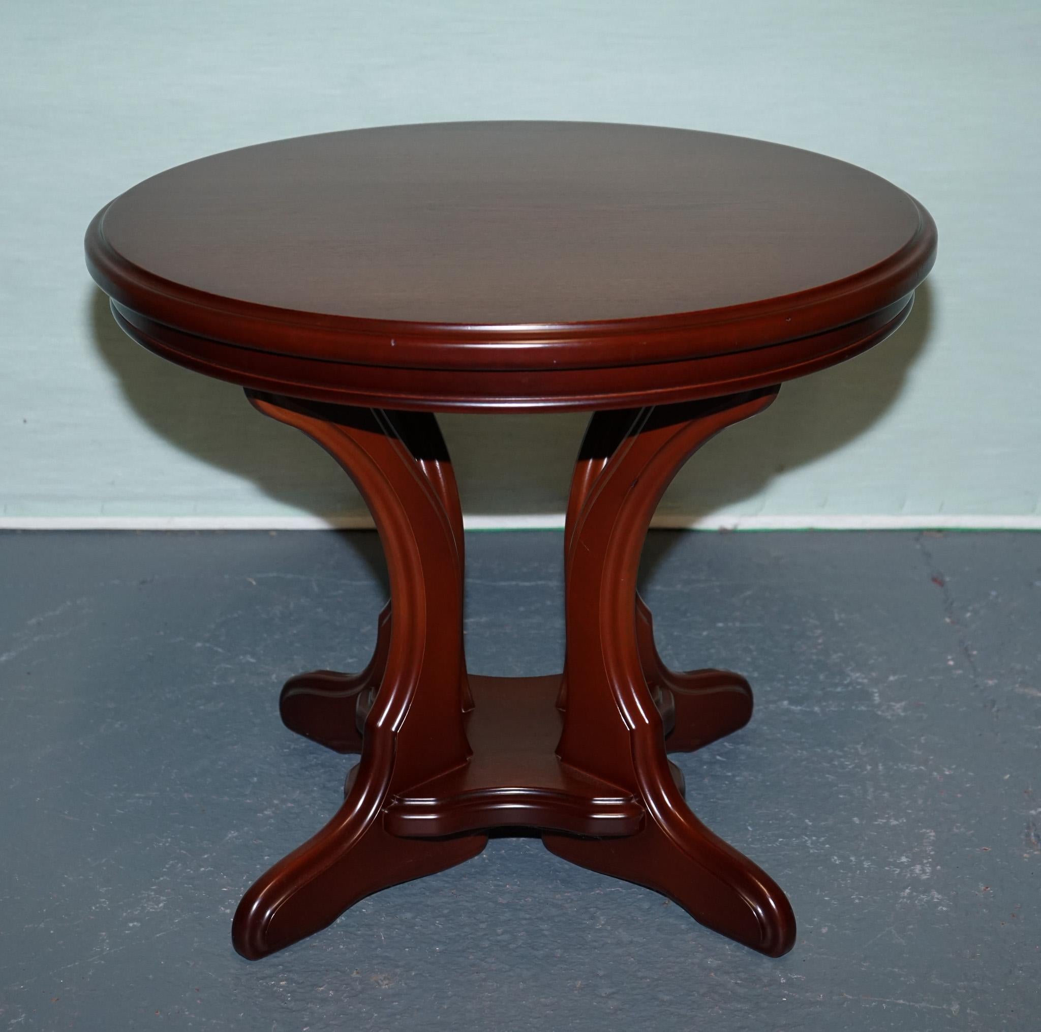 
Antiques of London

This elegant piece features a smooth, richly finished hardwood top resting on four gracefully curved legs joined by a contoured cross-stretcher base, adding both visual interest and structural integrity. 

The balanced
