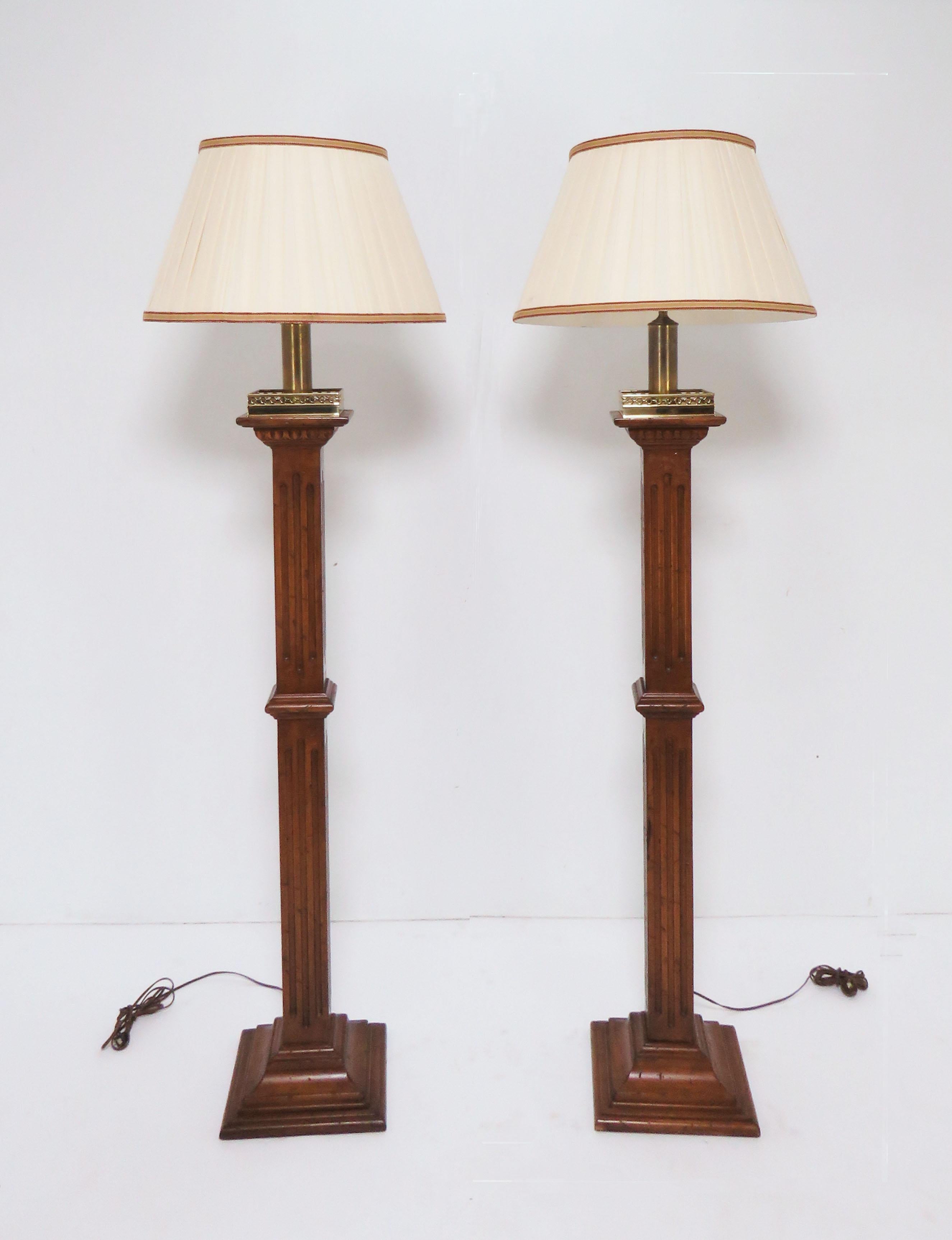A unique pair of Regency style wooden columnar floor lamps in walnut finish, crowned with solid brass decorative gallery rails, custom made for a Beacon Hill townhouse, circa 1970s. 66