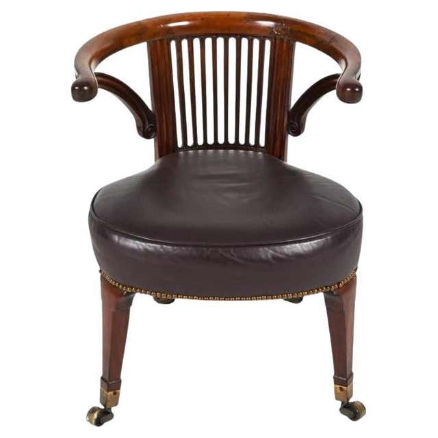 English Regency Style Leather Library Chair on Brass Casters at 1stDibs