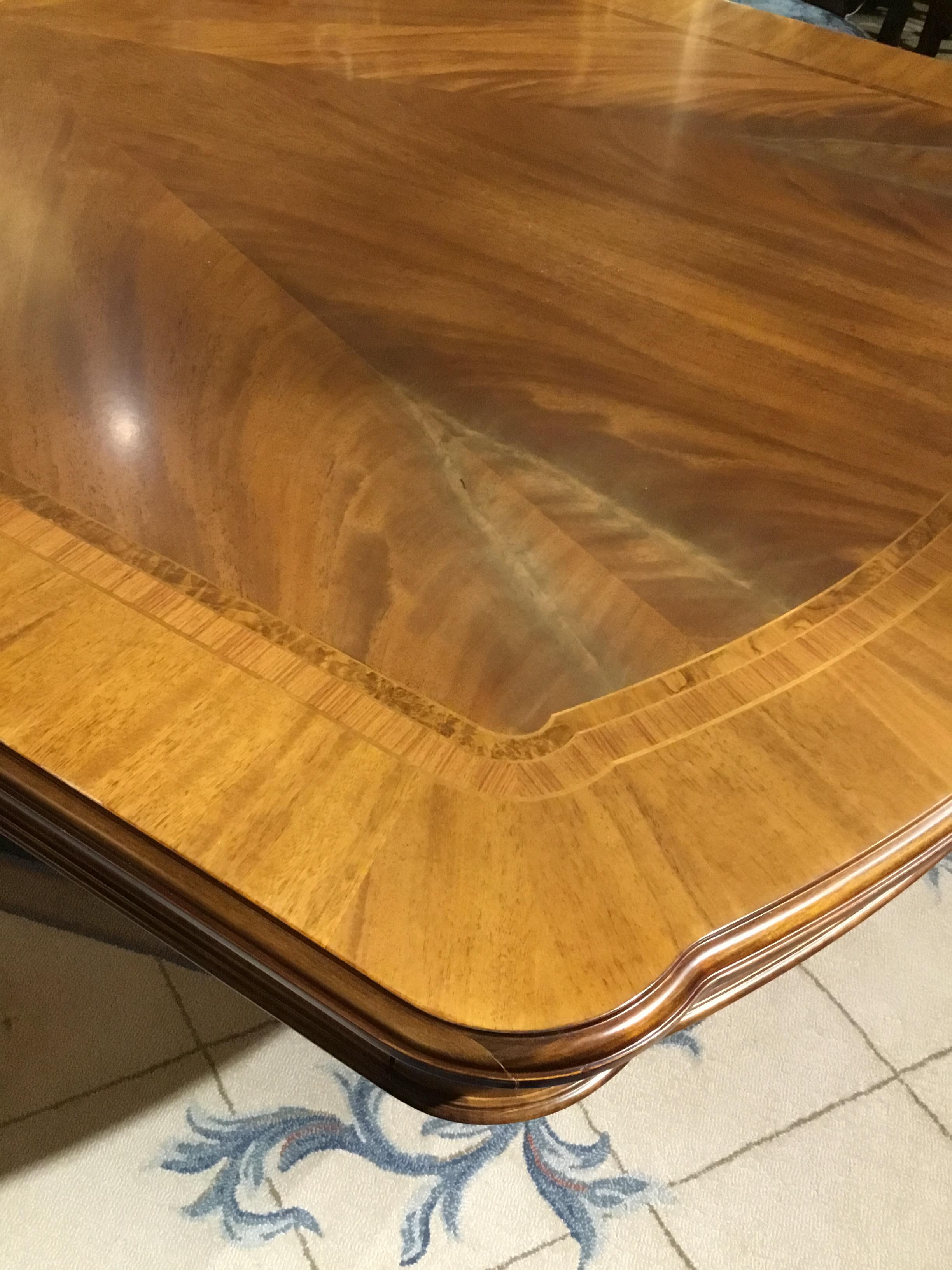 Italian Regency Style Dining Table Made of Finely Matched Veneers on Gilt Balusters