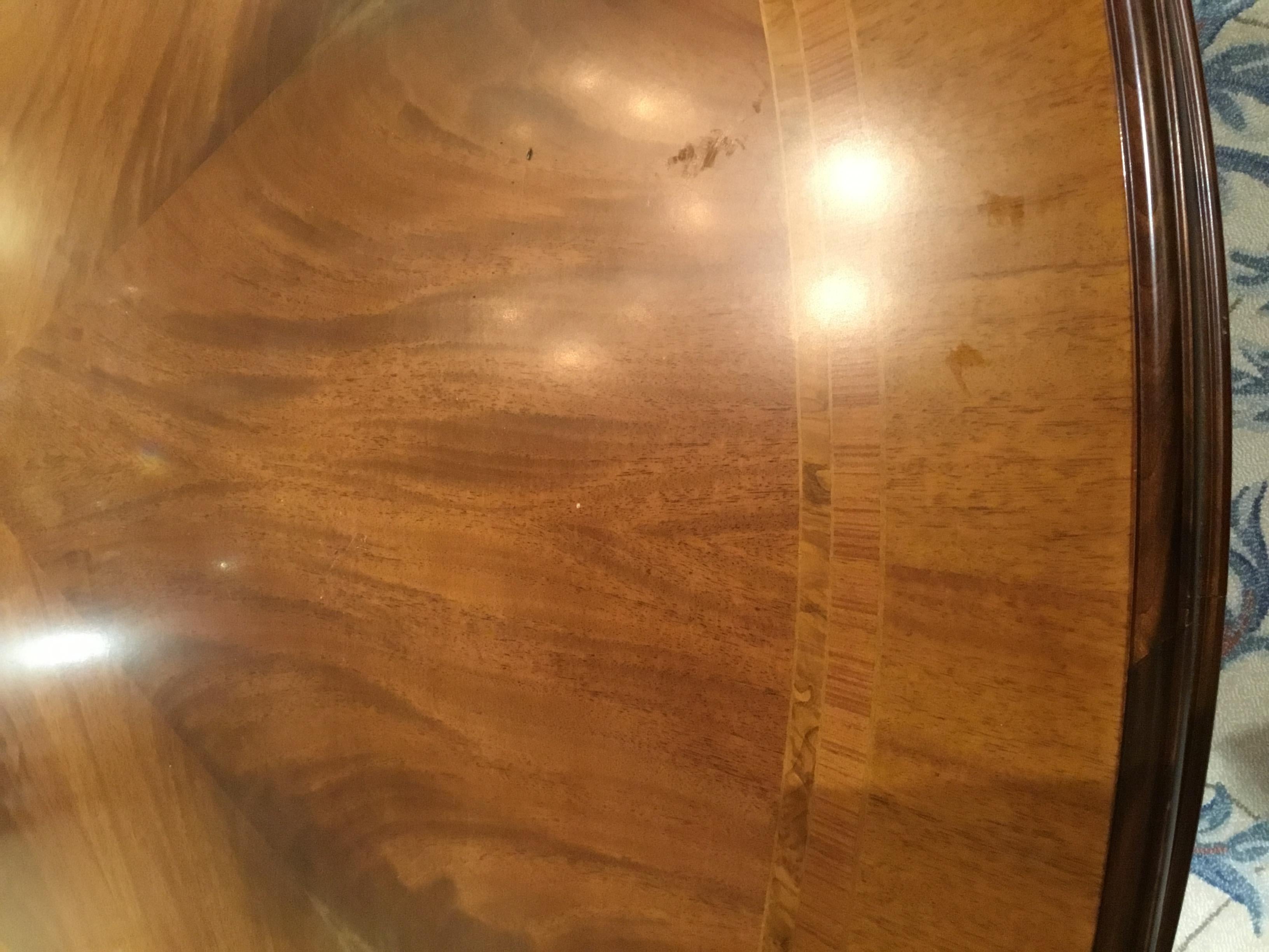 Made in Italy in the Regency style with finely matched veneers and having
An inlaid apron with an elegant design. The top rests on turned balusters with
Gilt Acanthus leaf overlay.