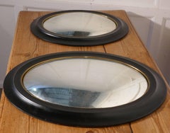 Regency Style Ebonised Convex Oval Wall Mirror