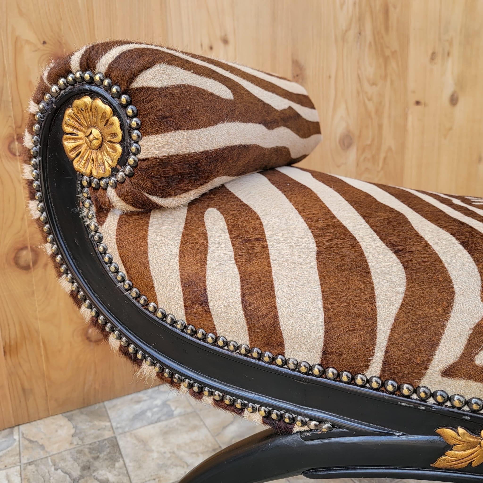 Regency style ebonized and gilded wood scroll-arm zebra striped Brazilian cowhide bench.

Beautiful 19th century regency style ebonized bowed leg, scroll-arm vanity bench, newly upholstered in a zebra striped brazilian hair-on hide. 

Circa 19th