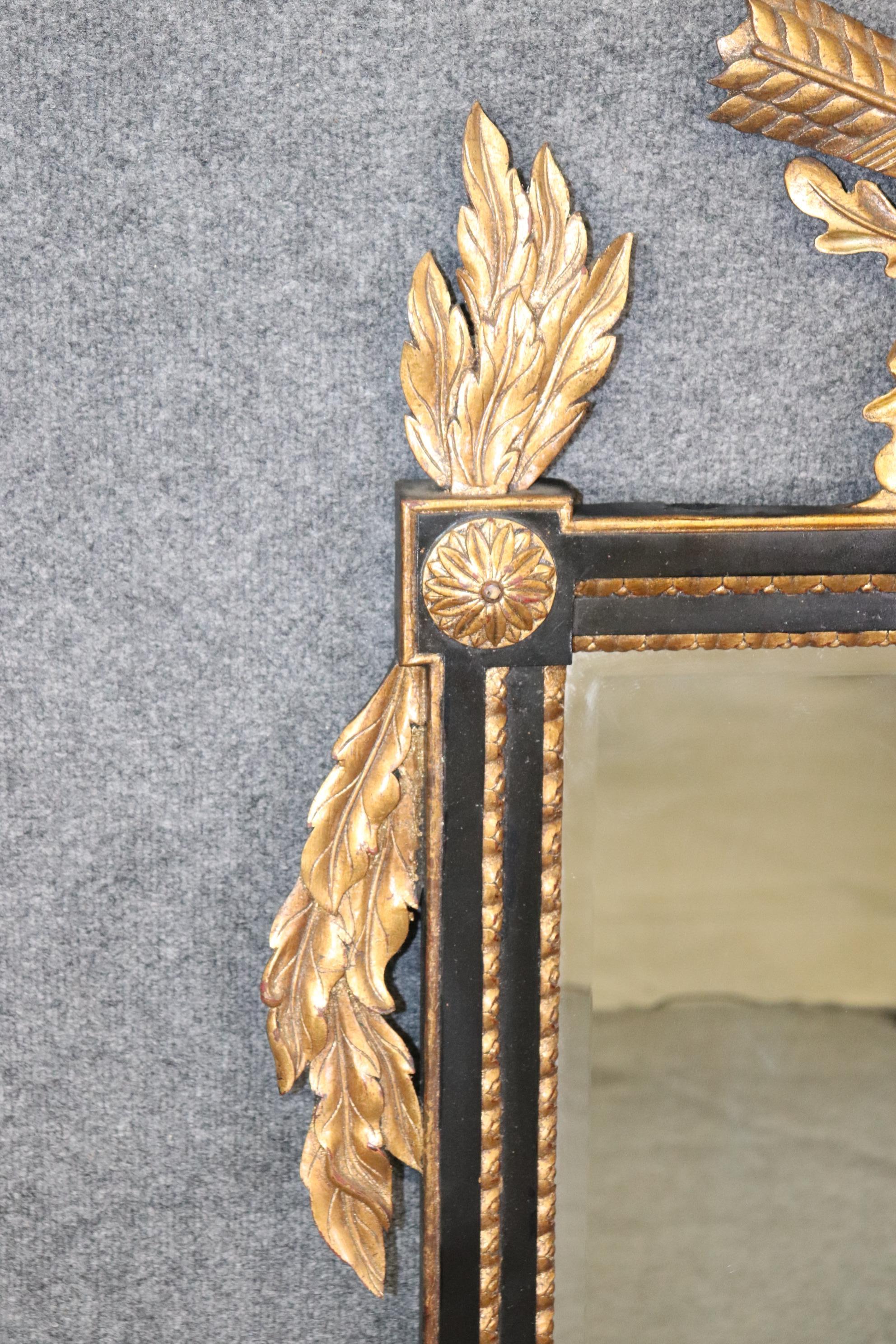 Regency Style Ebonized and Gilt Carved Floral Wall Hanging Mirror In Good Condition For Sale In Swedesboro, NJ