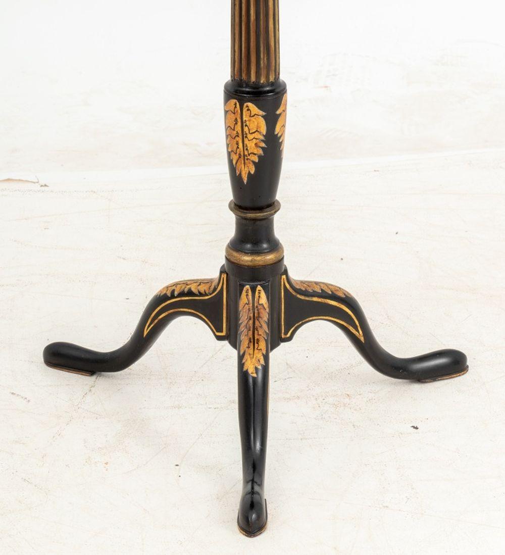 Regency Style Ebonized and Gilt Painted Wood Tripod Table, 19th century, the octagonal top with gilt tooled leather surface above a fluted stem. Top tilted: 40