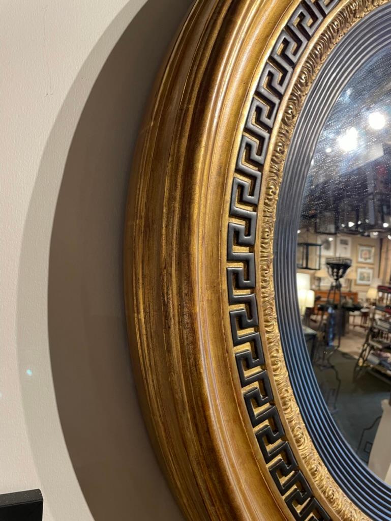 Regency Style Ebonized Gilt Wood Convex Mirror with Greek Key Molding In Good Condition In Stamford, CT