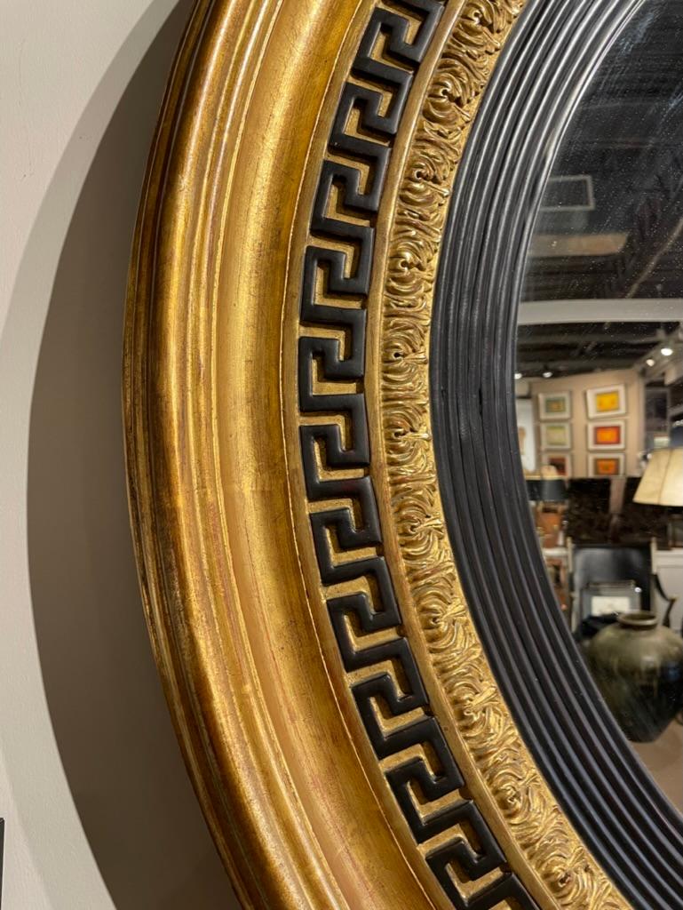 20th Century Regency Style Ebonized Gilt Wood Convex Mirror with Greek Key Molding