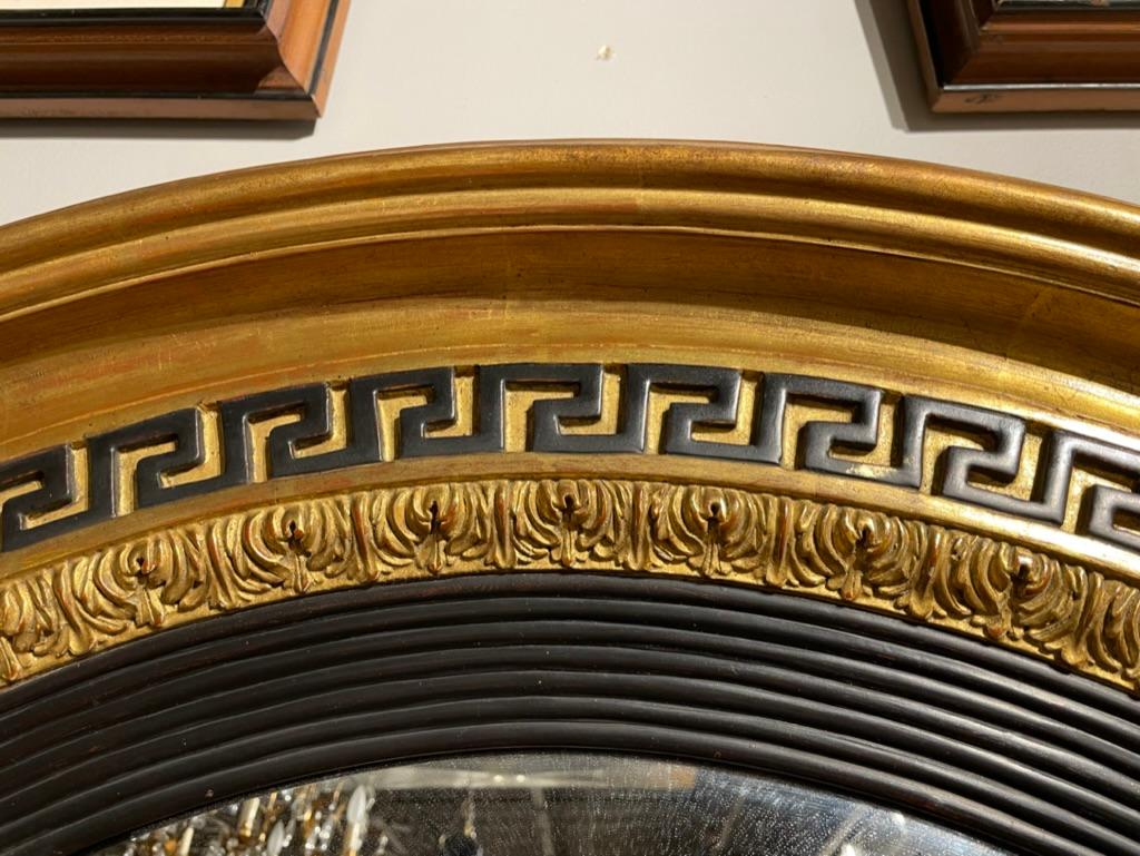 Giltwood Regency Style Ebonized Gilt Wood Convex Mirror with Greek Key Molding