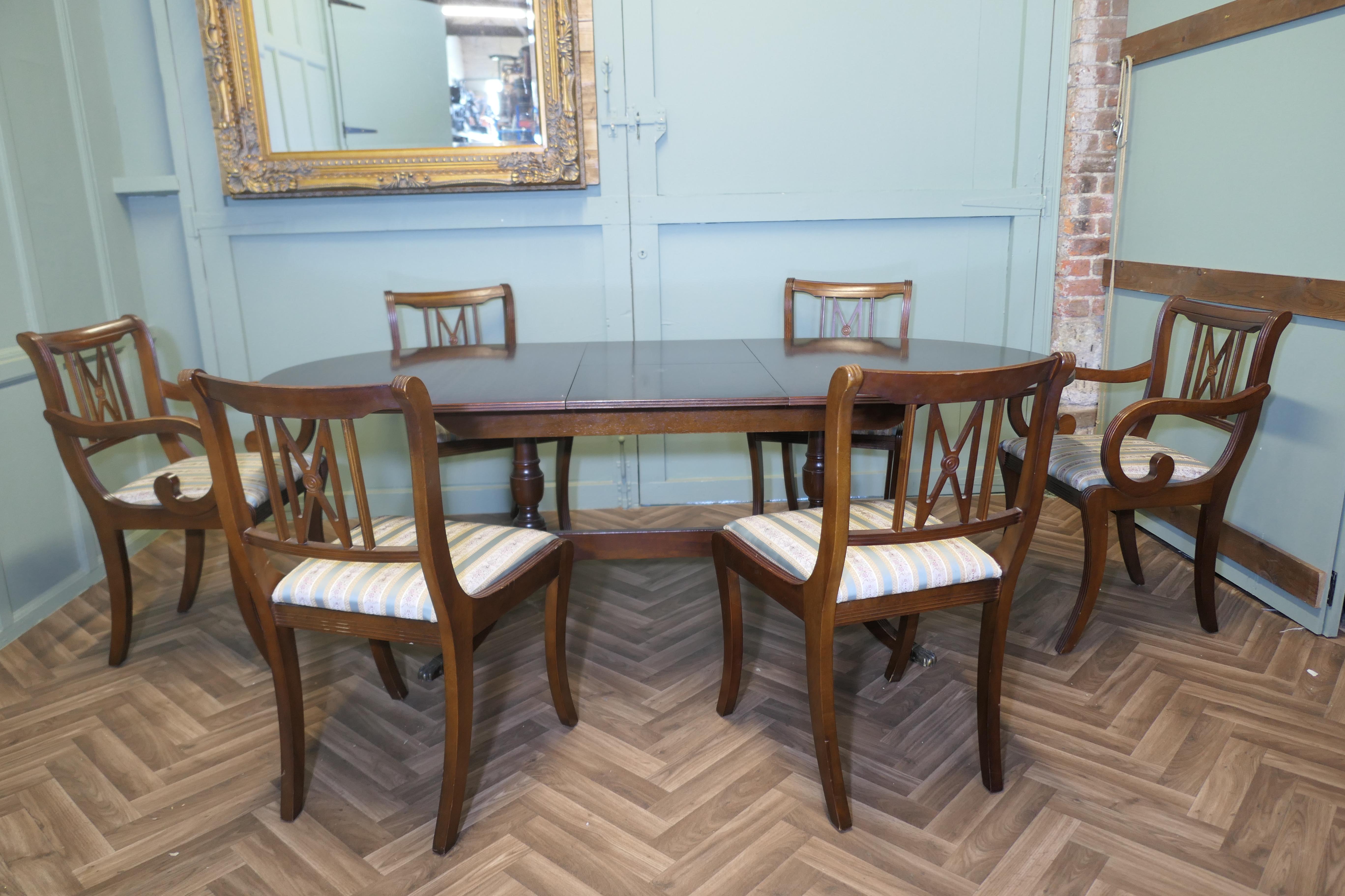 Regency Style Extending Dining Table and 6 Chairs

The table has a large leaf that is stored under the table top, it is set on a sturdy wooden base
The Table comes with a set of 6 dining chairs upholstered in a regency stripe fabric

The table and