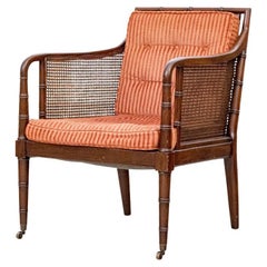 Regency Style Faux Bamboo And Cane Upholstered Lounge Chair