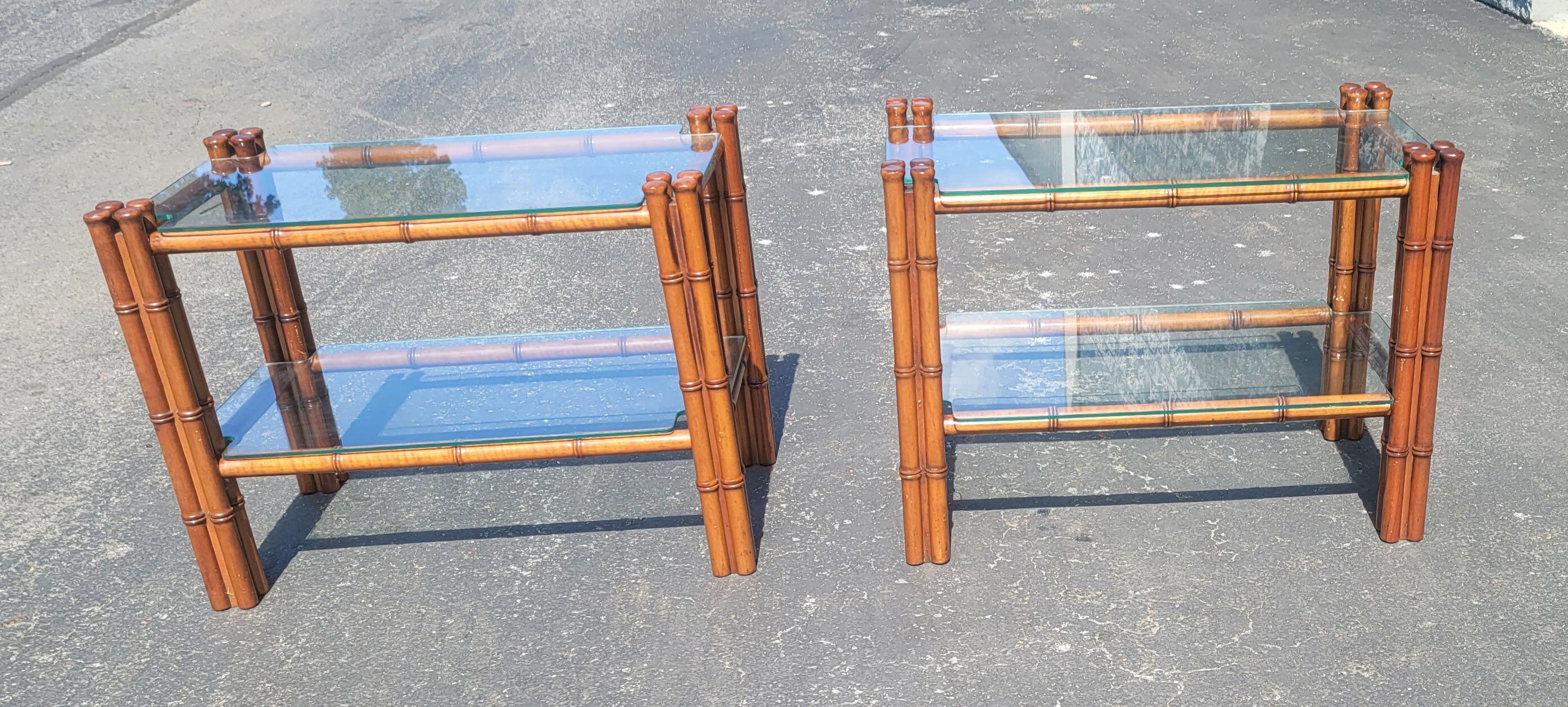 An exquisite pair Regency Style Faux Bamboo Mahogany Two Tier Glass Side Tables with custom glass top and shelf. Absolutely charming set , measuring 16 inches in width, 27.5 inches in depth and 21 inches in height. A true rare find. The matching