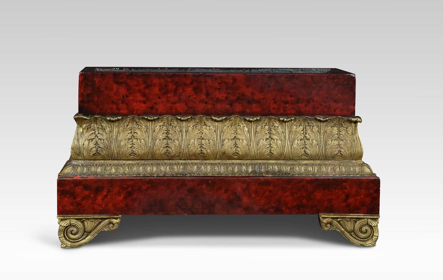 Regency style faux tortoiseshell jardinière of rectangular form having foliated gilded border. All raised up on scrolling feet.
Dimensions:
Height 9.5 inches
Width 16.5 inches
Depth 7 inches.