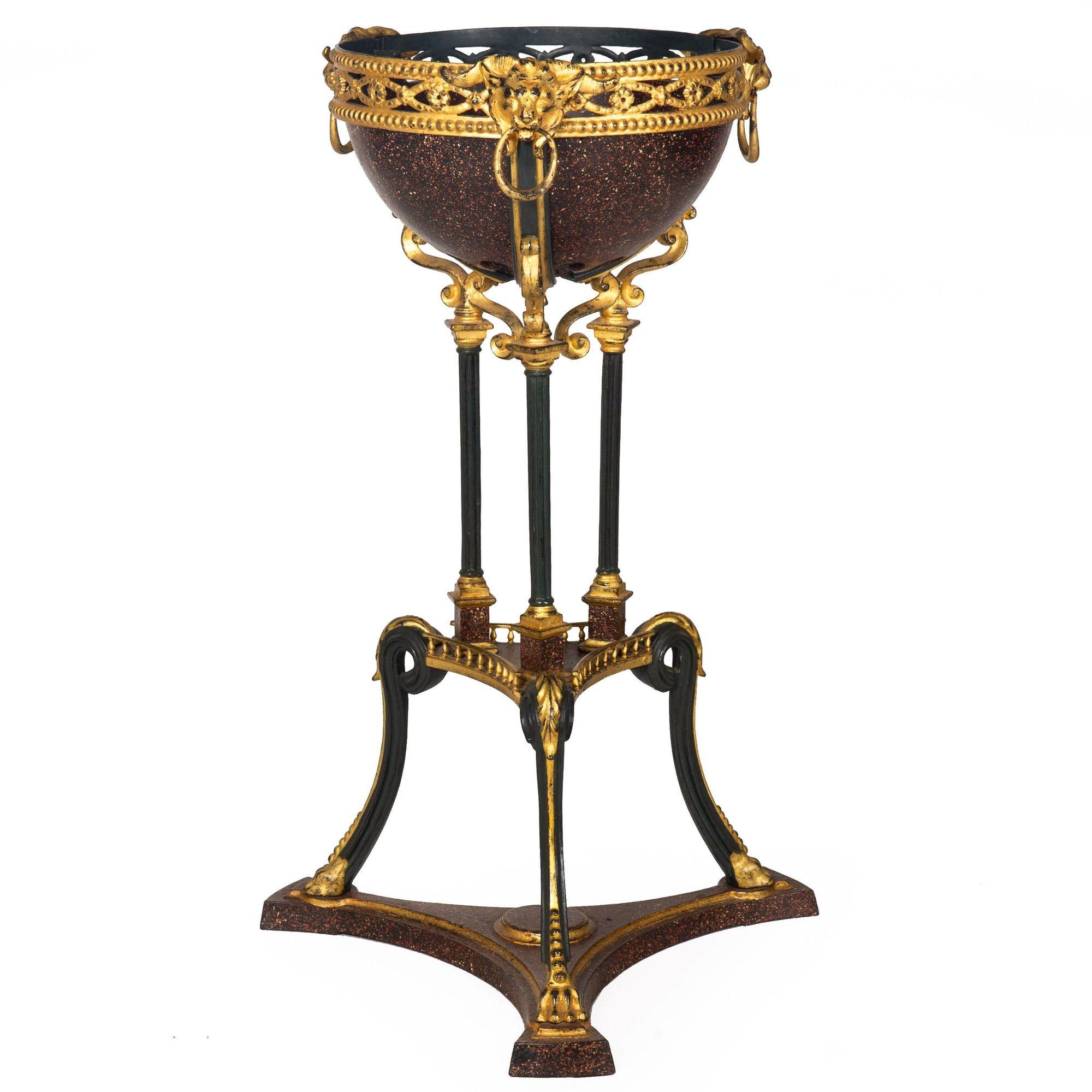 REGENCY STYLE GILT AND FAUX-PORPHYRY IRON ATHENIENNE JARDINIERRE
Early 20th century, likely designed to be used as a jardinierre
Item # 407MYK10M

Unusual and eye-catching, this bold Regency-style athenienne is cleverly designed entirely out of