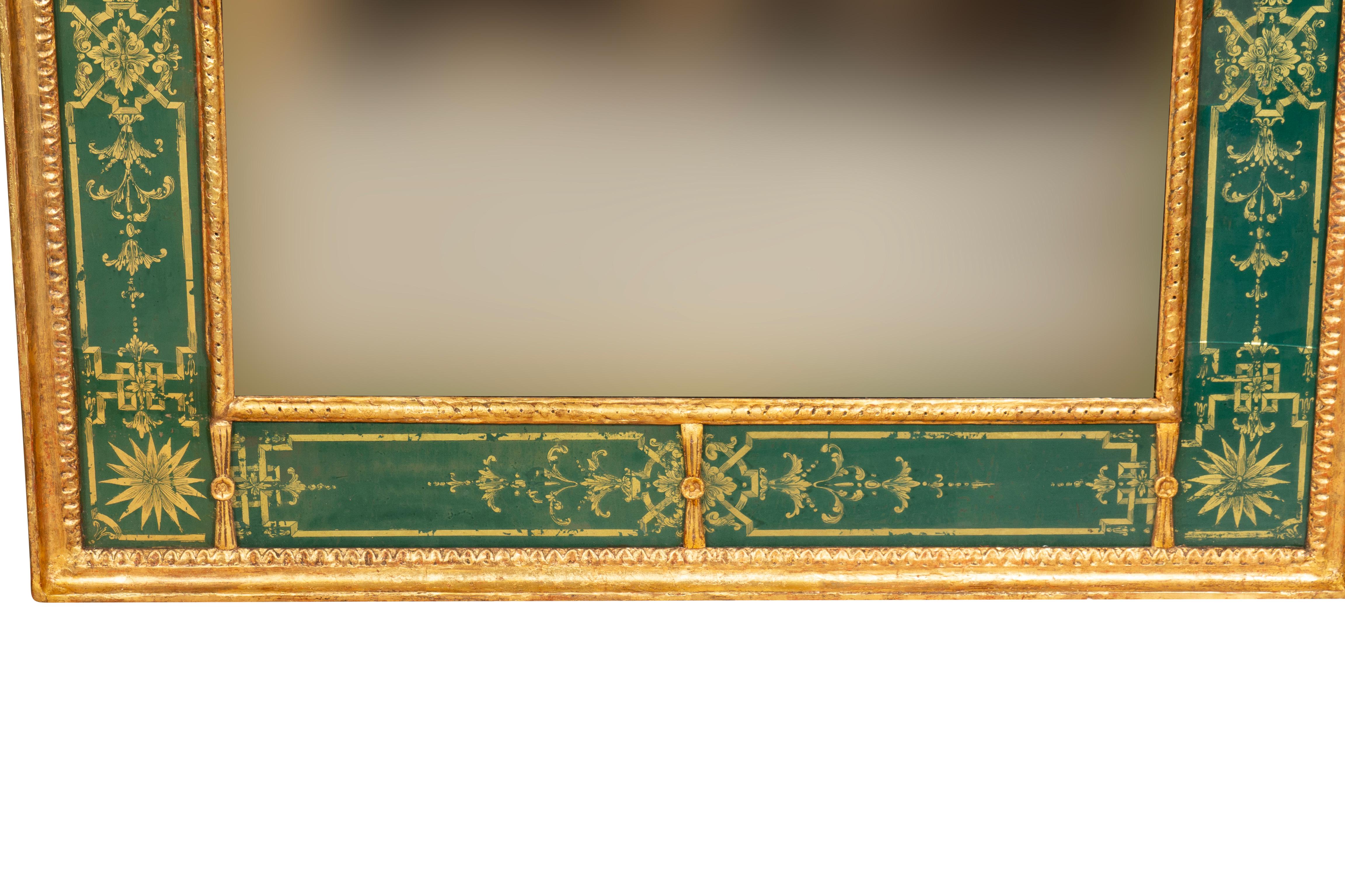 Rectangular with gilt wood leaf tip and guilloche frame with green and gold eglomise inner border and mirror at center. Some eglomise panels with cracks.