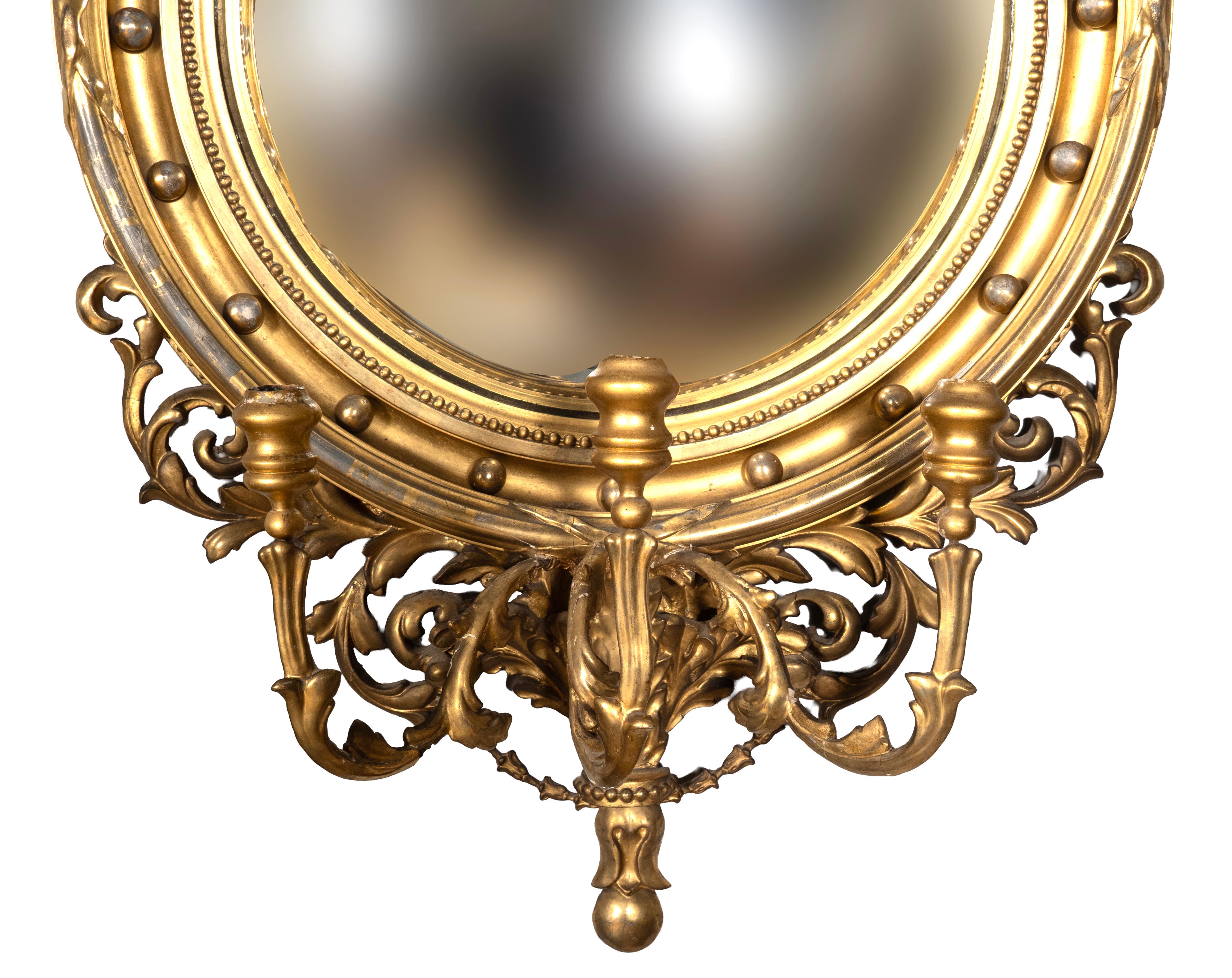 With Salem Massachusetts history. Eagle superstructure with laurel leaf swags over a convex mirror over a three arm candelabra. 
