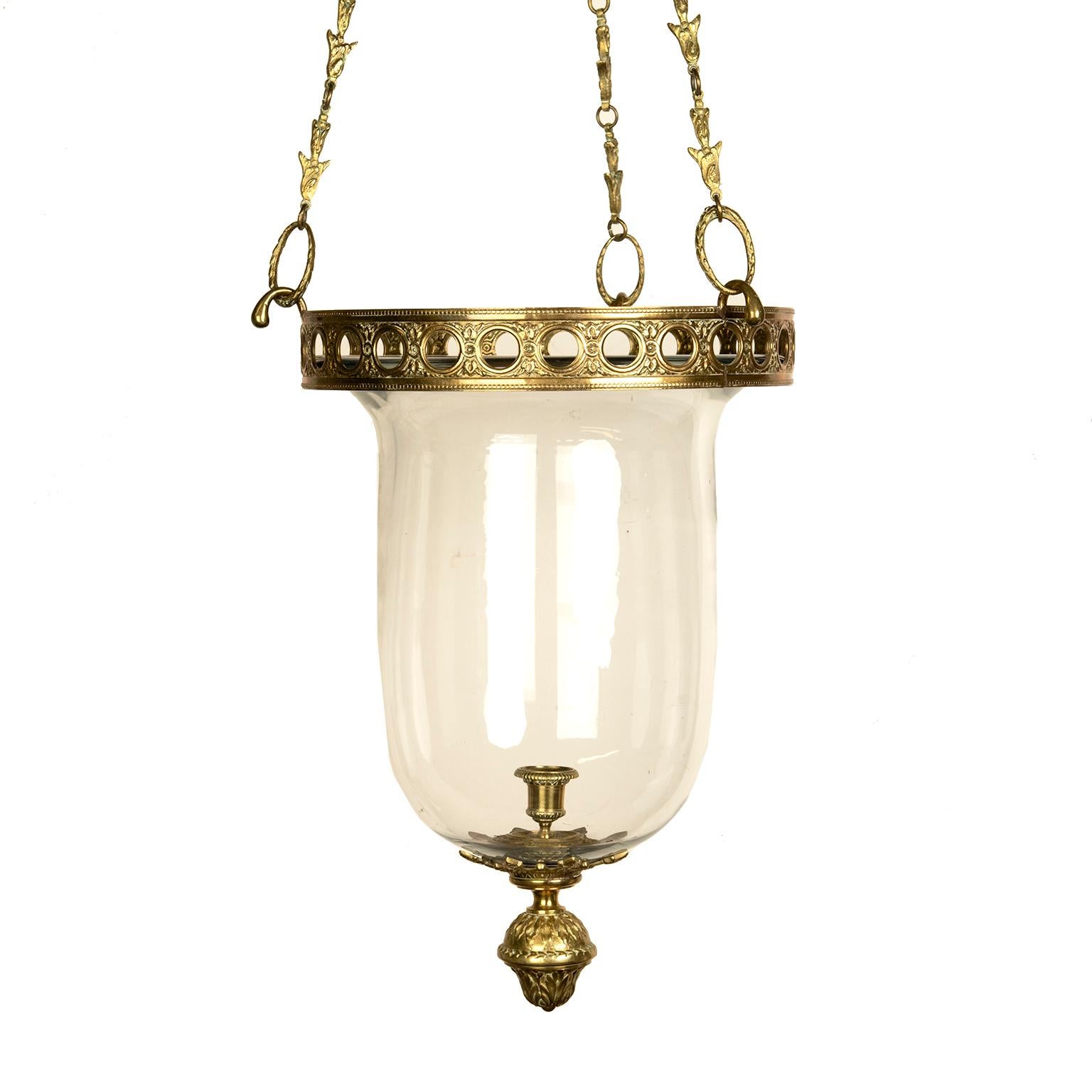 This quality vintage decorator French hurricane lantern is made of cast bronze metal and a generous weighty glass bell jar. It is made for a single candle sconce but can be modified with a 2-3 light cluster if
so desired.