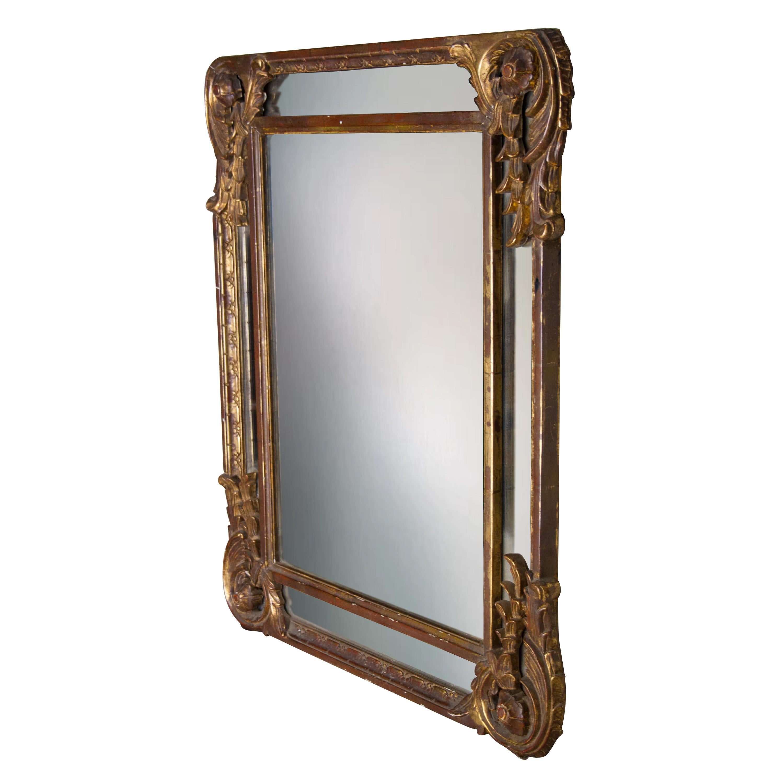 Neoclassical rectangular handcrafted mirror. Rectangular hand carved wooden structure with gold foil finished, Spain, 1970.