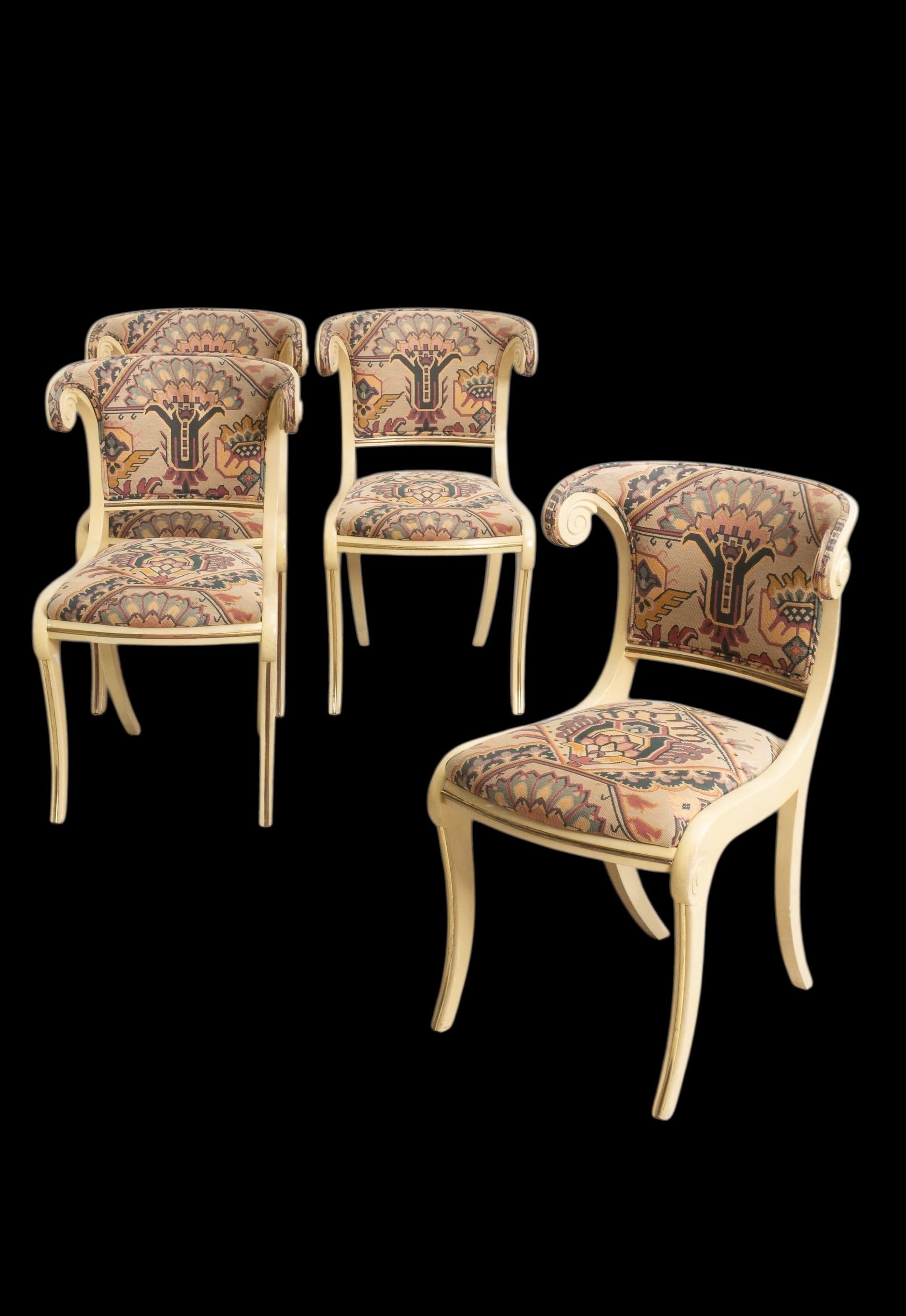 Love these! This is a set of four Italian Klismos style painted side chairs. The upholstery is vintage with no holes and lite wear. They are unmarked. Fabulous for a game table or small statement dining space.