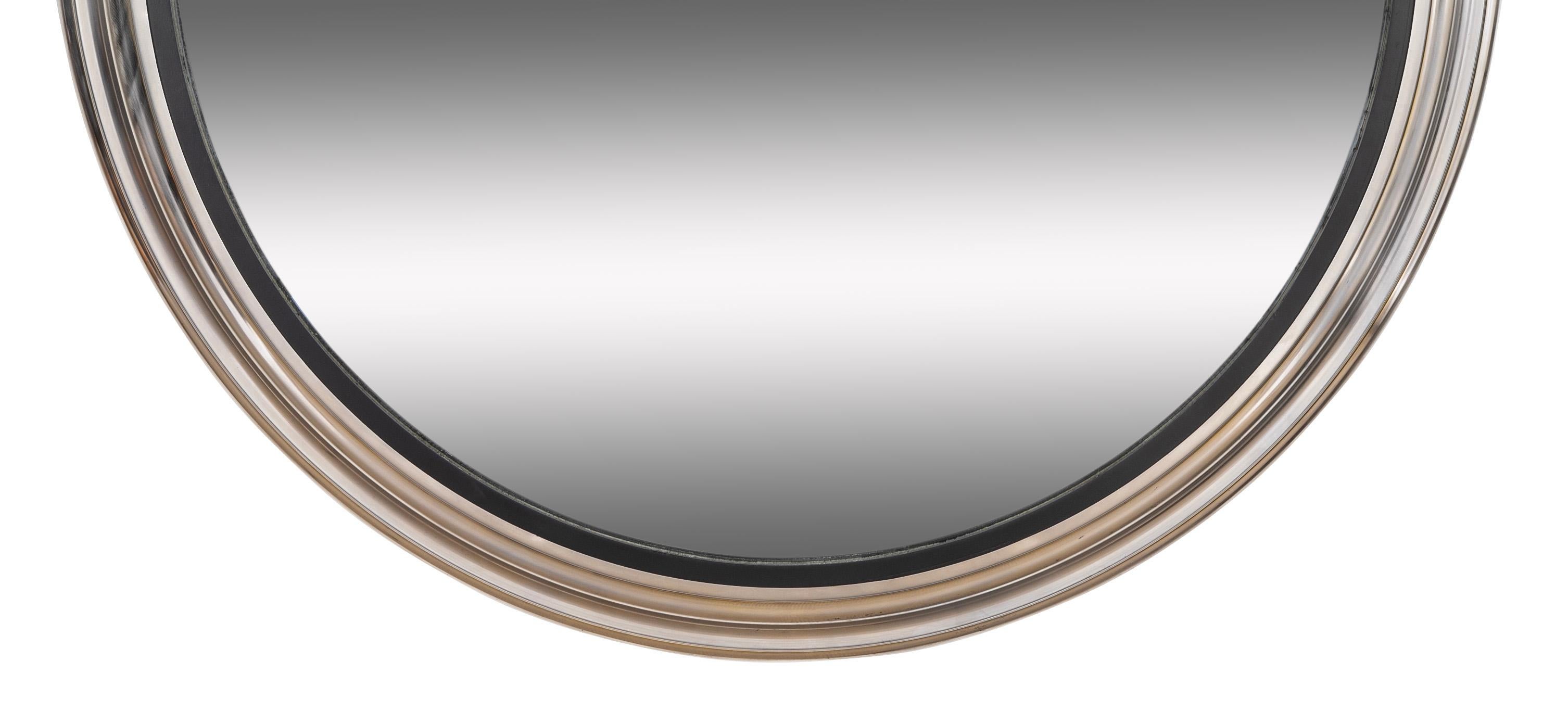 An elegant large scale convex mirror, the frame of rolled steel with ogee molding, with brushed finish. A great fit for both modern and classical interiors, a pared down contemporary take on the Neoclassical and Regency style. Custom made, circa