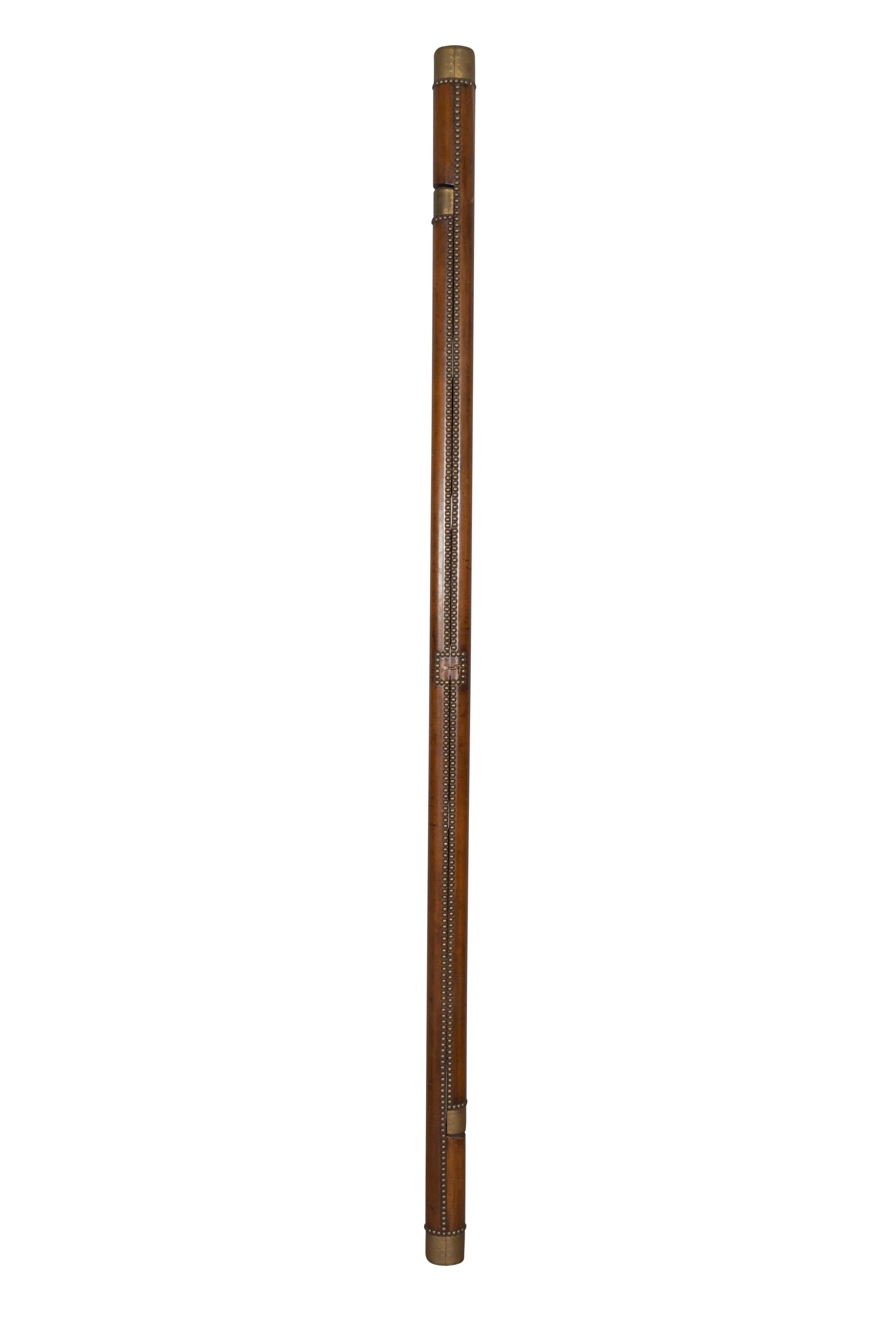 Folds into a stick. Wood core covered in brown leather with brass tacks. Hook latch to keep it closed. When closed its 91 inches high. Rungs are 9.25 inches wide.